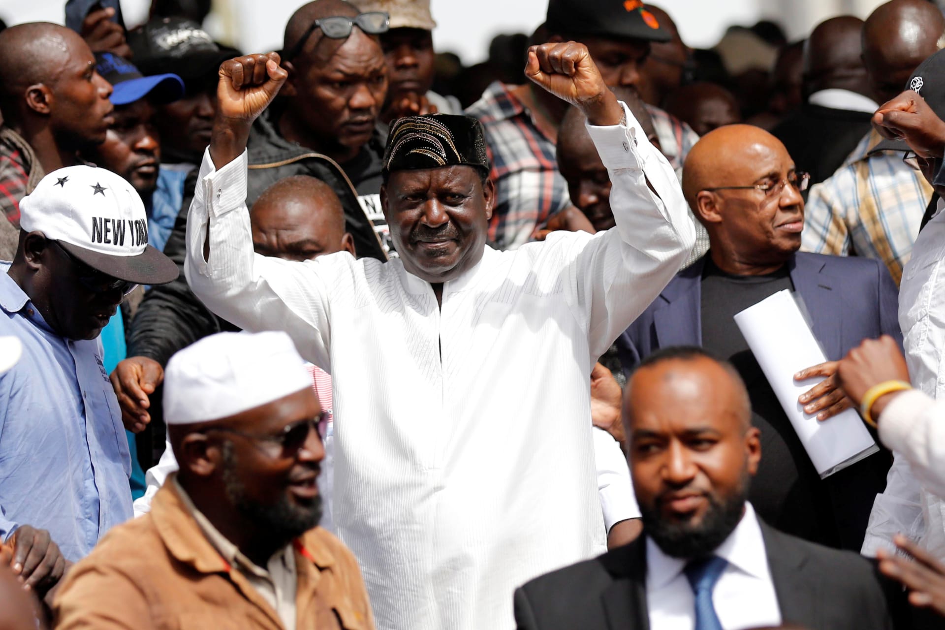 <p>Kenyan opposition leader Raila Odinga of NASA coalition gestures during a swearing-in ceremony as the president of the People’s Assembly in Nairobi, Kenya January 30, 2018.</p>