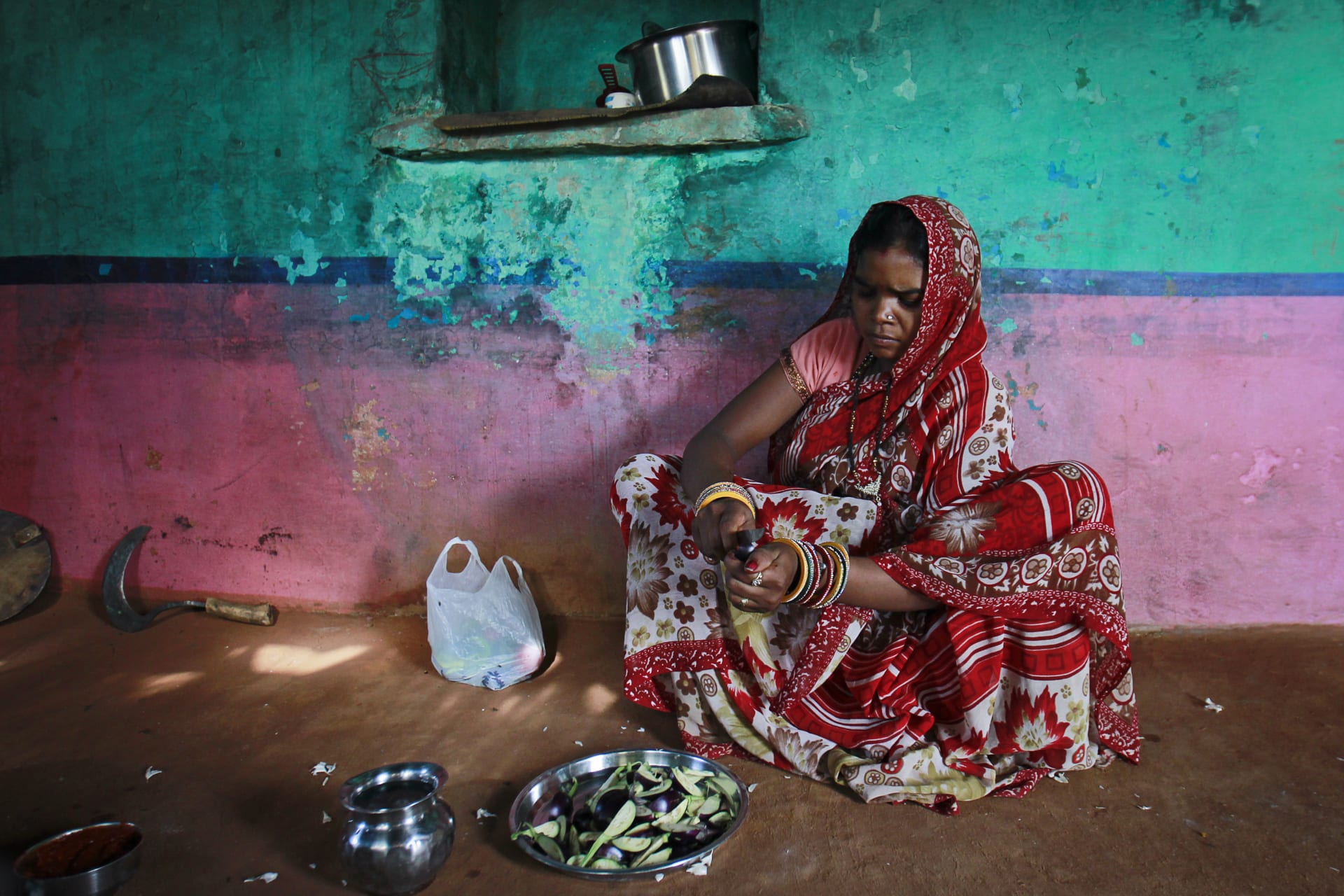 <p>Krishna, 13, cuts vegetables inside the kitchen at her house in a village near Baran, located in the northwestern state of Rajasthan, July 17, 2012. Krishna married her husband Gopal when she was 11 and he was 13.</p>
