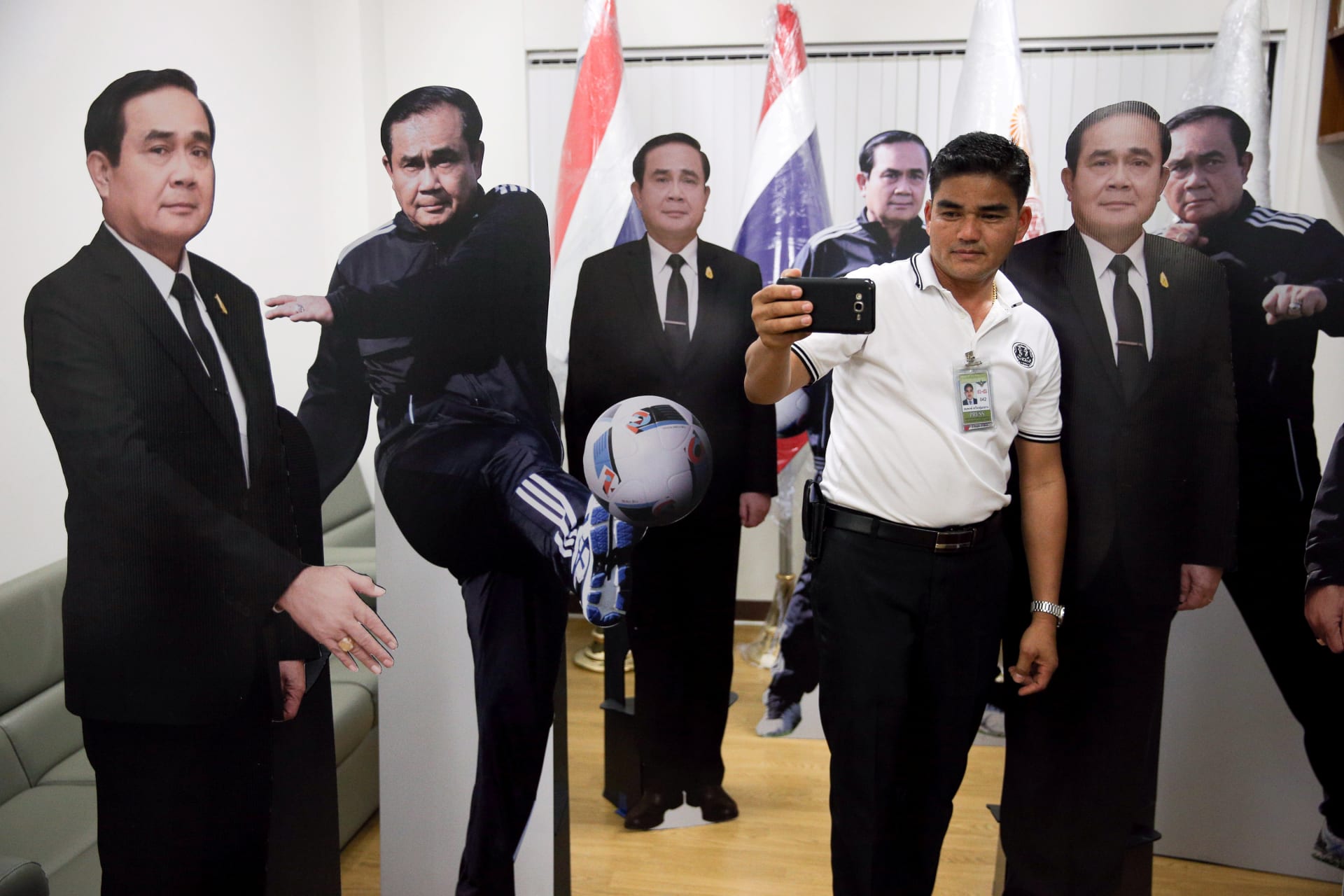 <p>A journalist selfies with cardboard cut-outs of Thailand’s Prime Minister Prayuth Chan-ocha at Government House in Bangkok, Thailand, on January 9, 2018.</p>