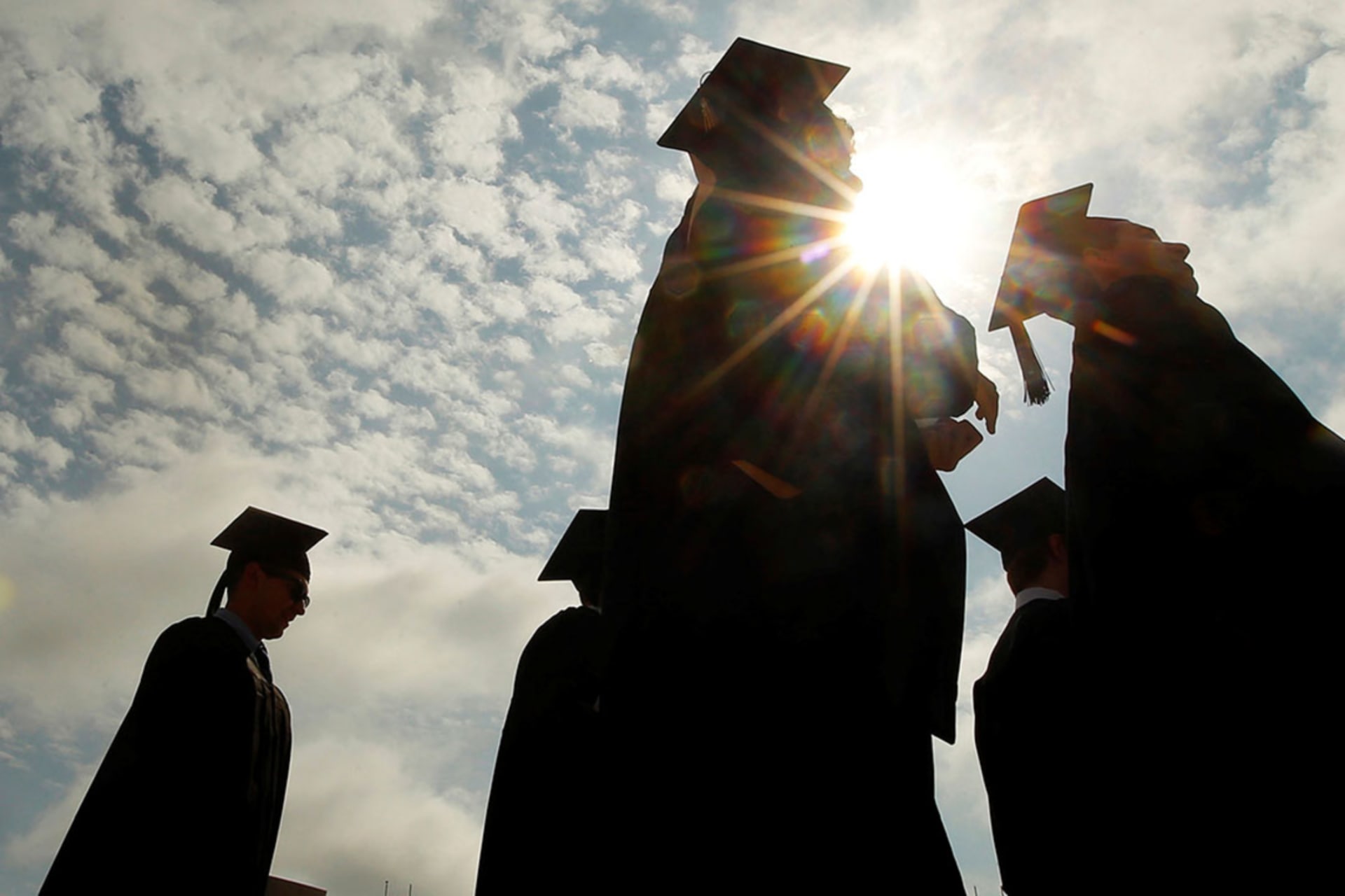 <p>Graduating students arrive for commencement exercises at Boston College in Boston, Massachusetts, on May 20, 2013.</p>
