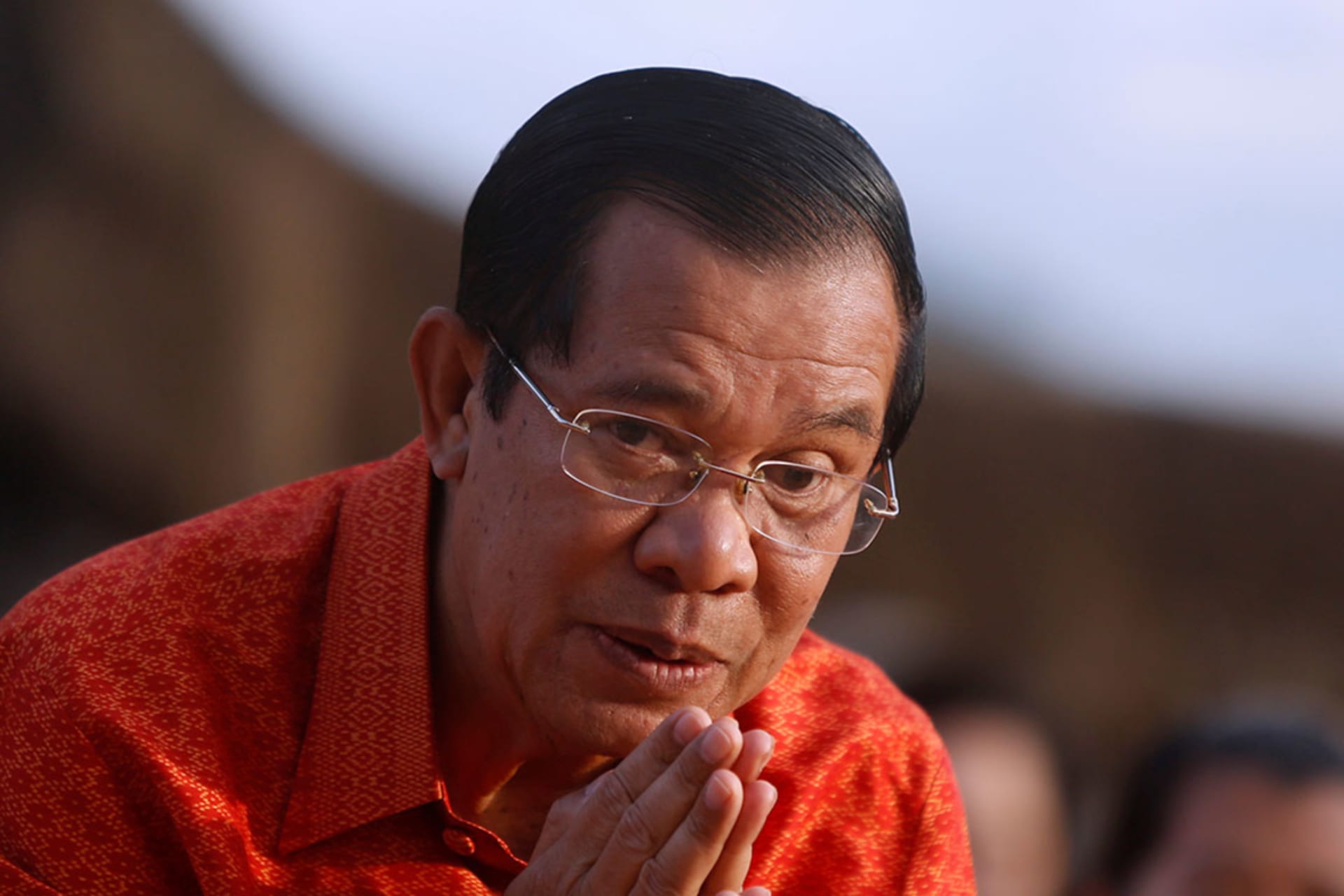 <p>Cambodia’s Prime Minister Hun Sen greets as he holds a ceremony at the Angkor Wat temple to pray for peace and stability in Cambodia, in Siem Reap province, Cambodia on December 3, 2017.</p>

