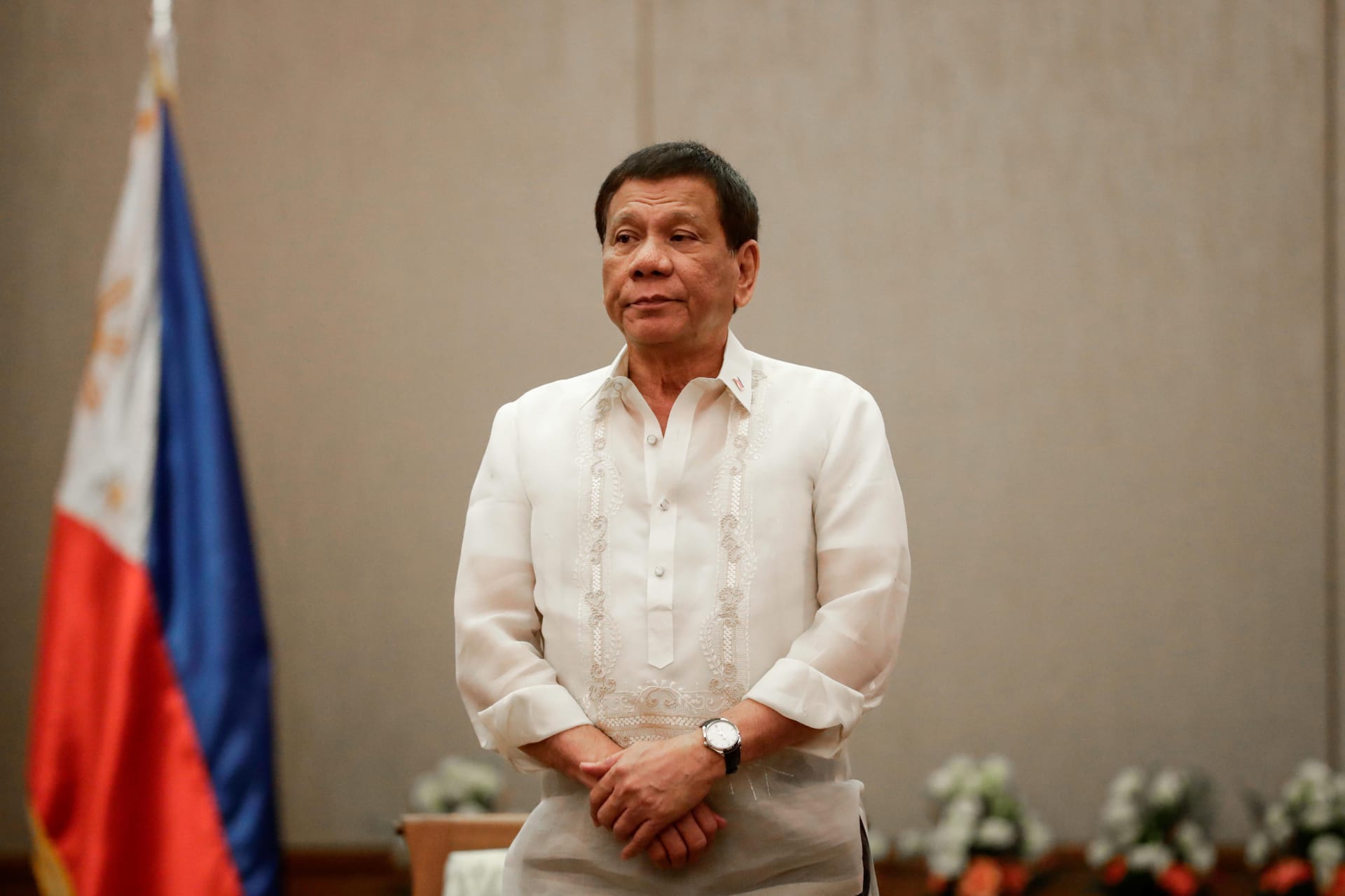 <p>Philippines’ President Rodrigo Duterte stands at attention during a courtesy call with the Association of Southeast Asian Nations Economic Ministers in Manila, Philippines, on September 6, 2017.</p>
