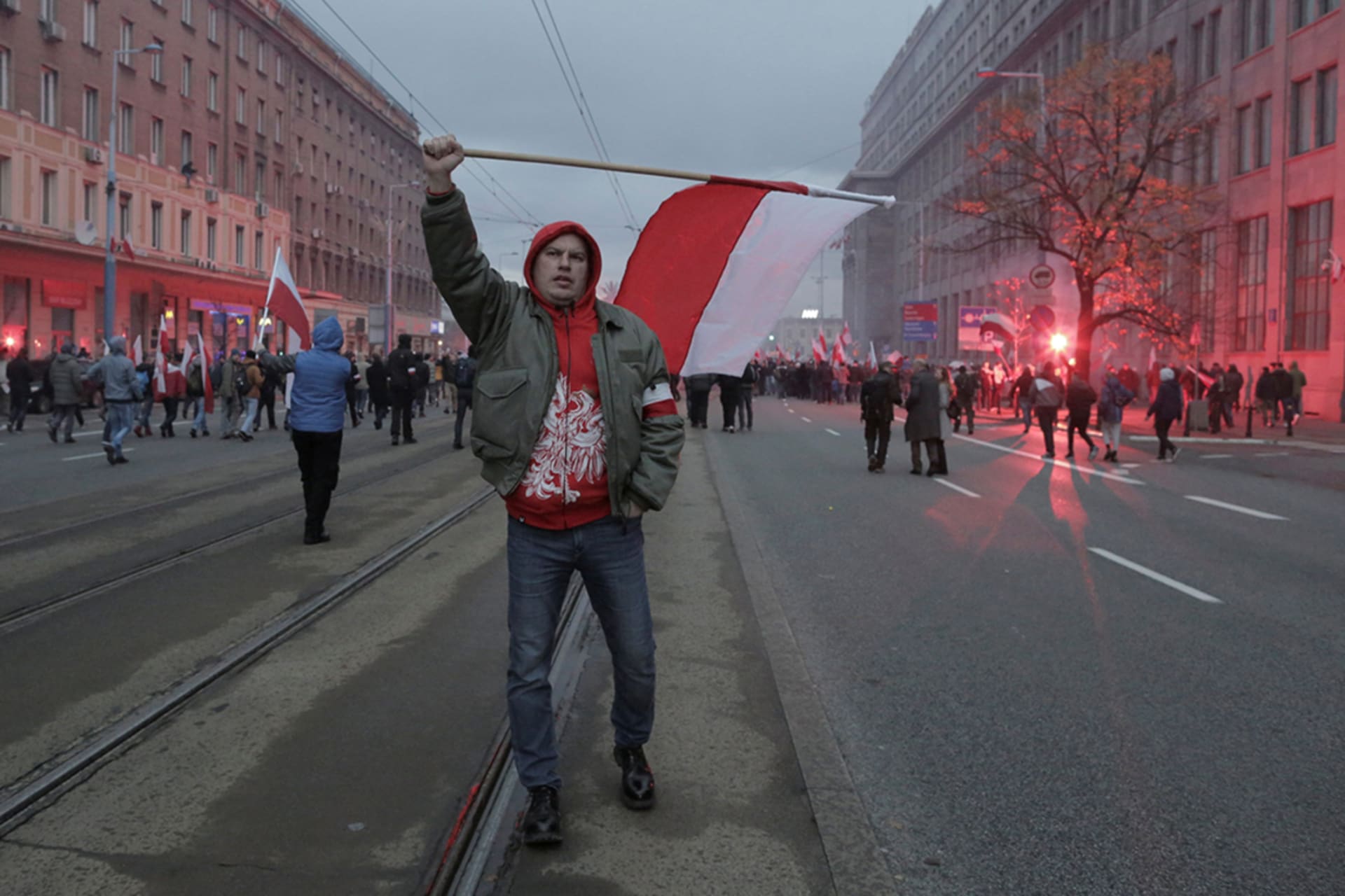 <p>Protesters carry Polish flags during a rally, organized by nationalist groups, to mark the anniversary of Polish independence.</p>
