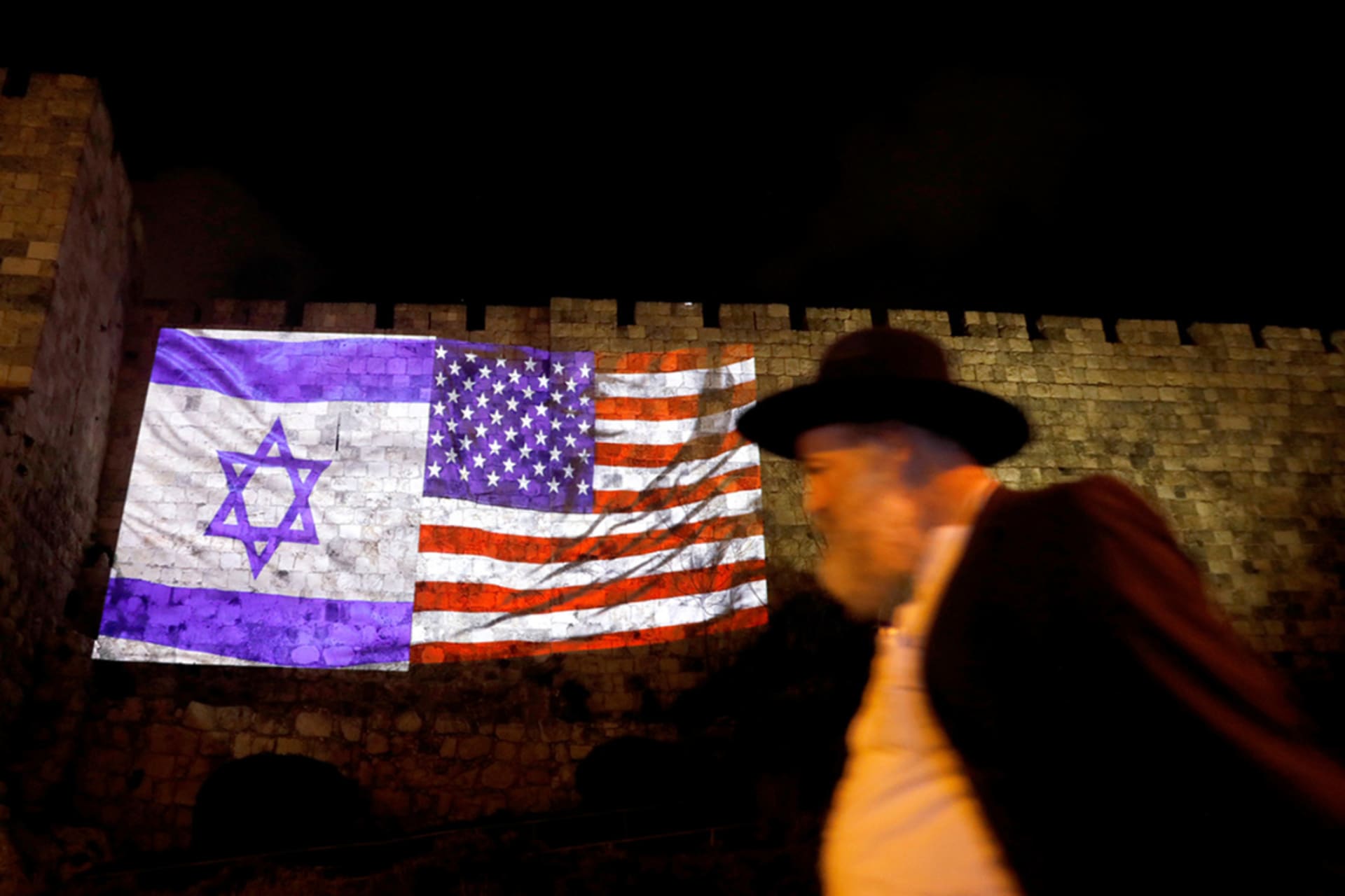 <p>The Israeli and American flags are projected on the walls surrounding Jerusalem’s Old City.</p>