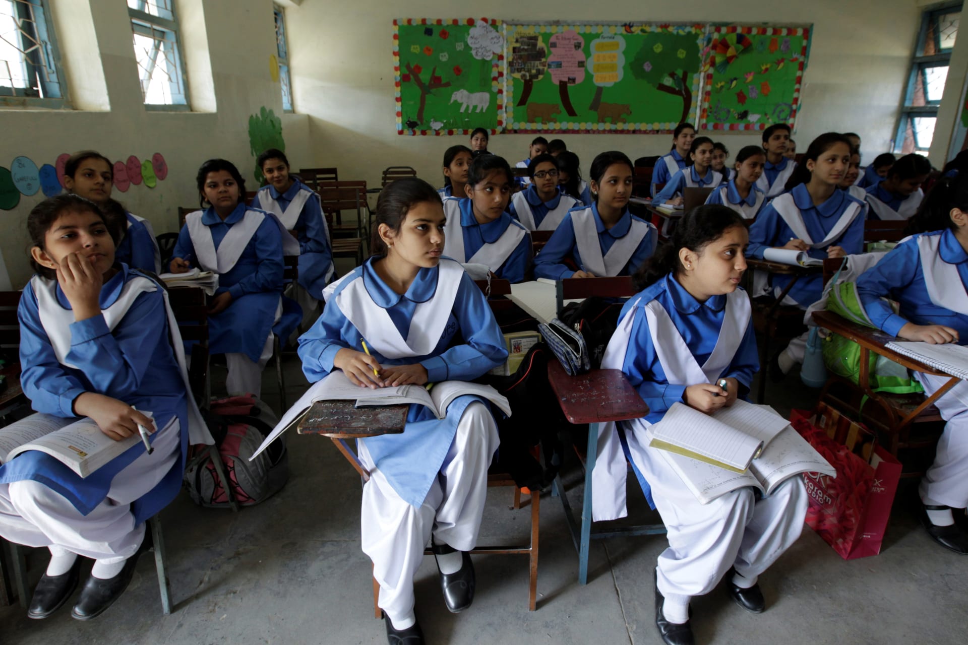 <p>Students listen to their teacher during a lesson at the Islamabad College for girls in Islamabad, Pakistan, October 13, 2017. Women make up less than 18 percent of Pakistan’s science, technology, engineering, and mathematics (STEM) professionals. </p>