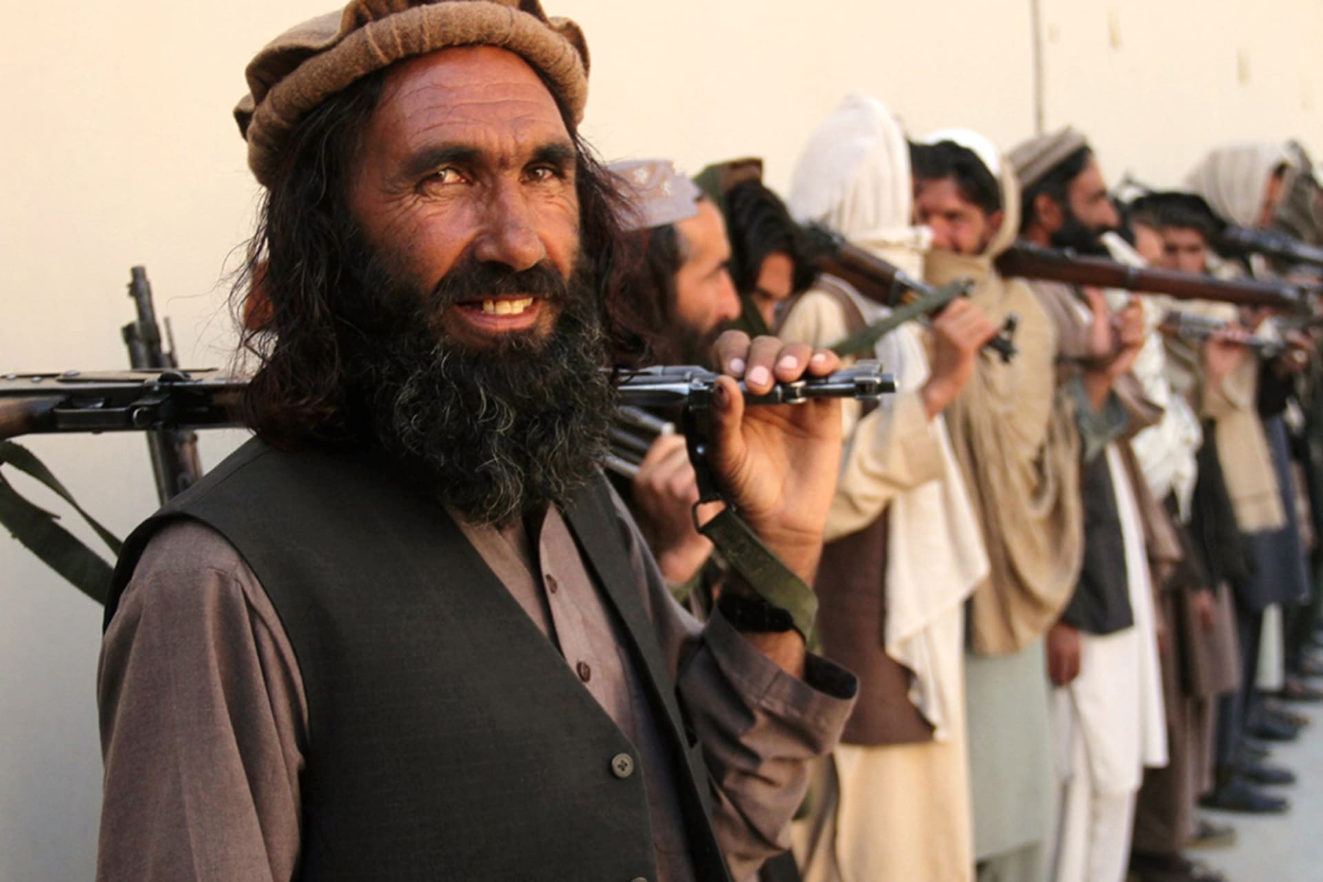 <p>Taliban fighters in eastern Nangarhar Province attend a surrender ceremony in 2016.</p>
