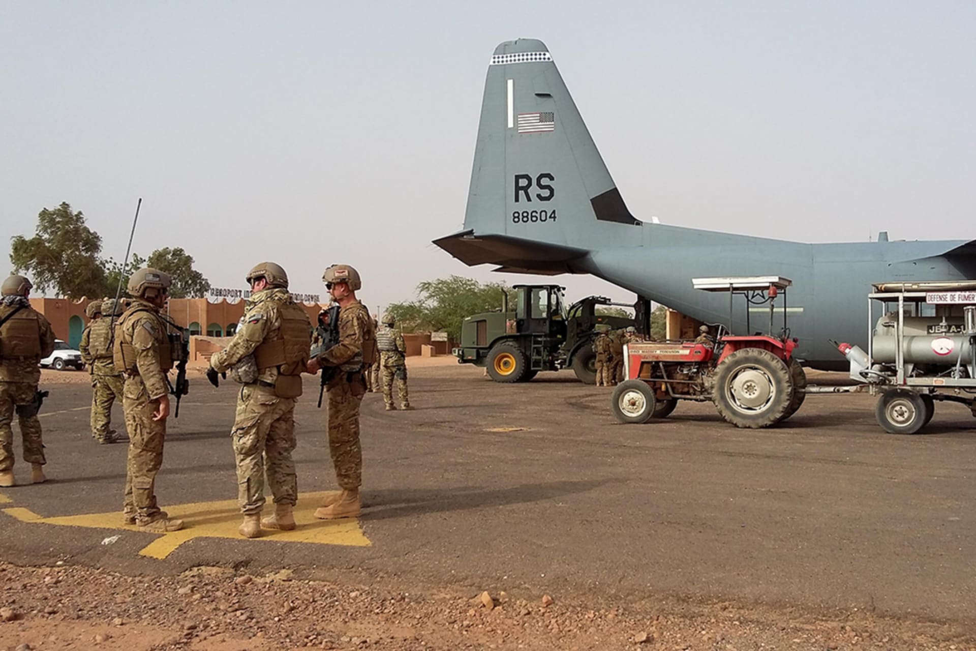 <p>Airmen unload a C-130J Super Hercules during a deployment at Agadez, Niger.</p>
