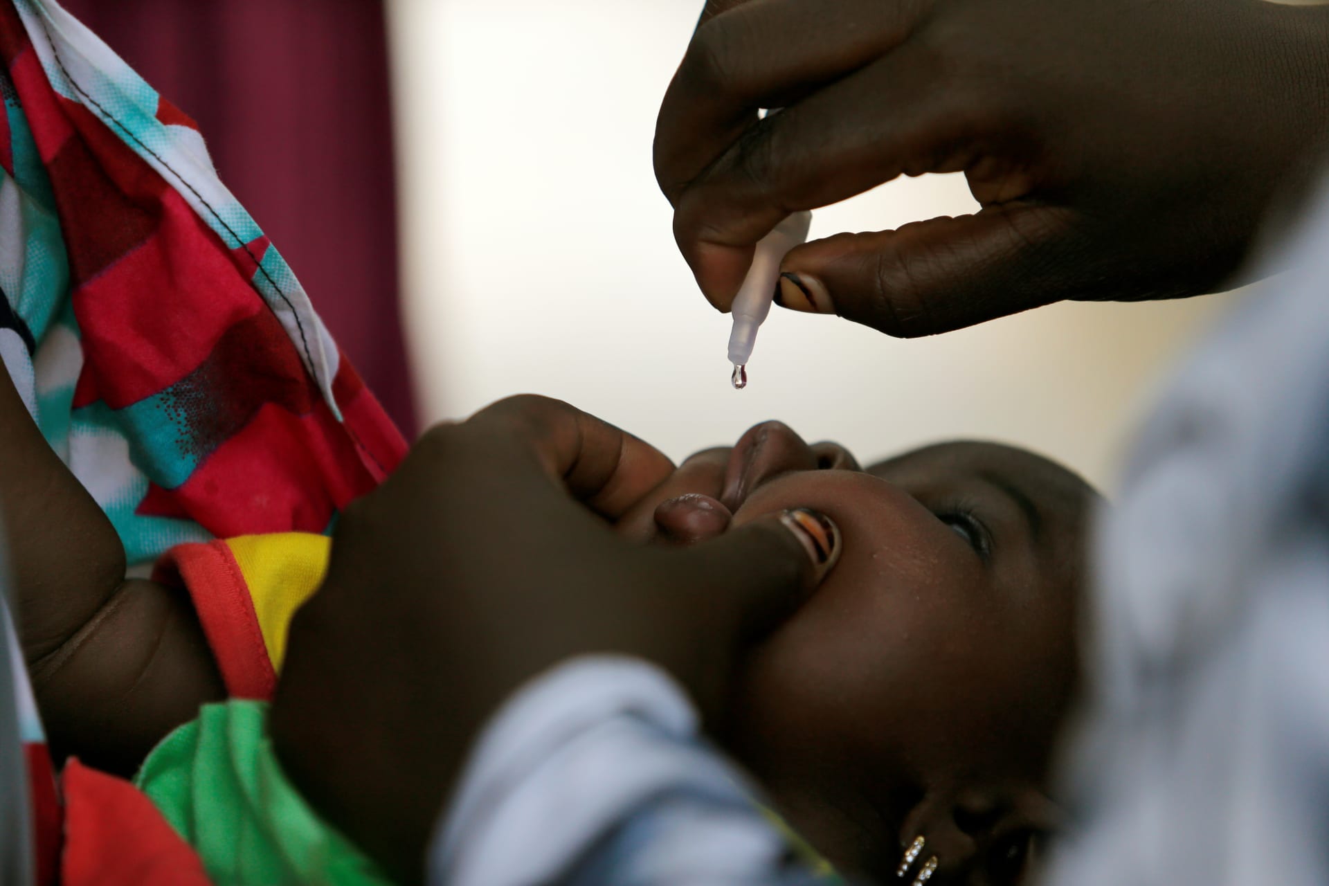<p>A child is given a dose of polio vaccine at an immunization health center, in Maiduguri, Borno State, Nigeria, August 29, 2016. Boko Haram has wrought immense destruction to Borno state and the greater Lake Chad basin.</p>
