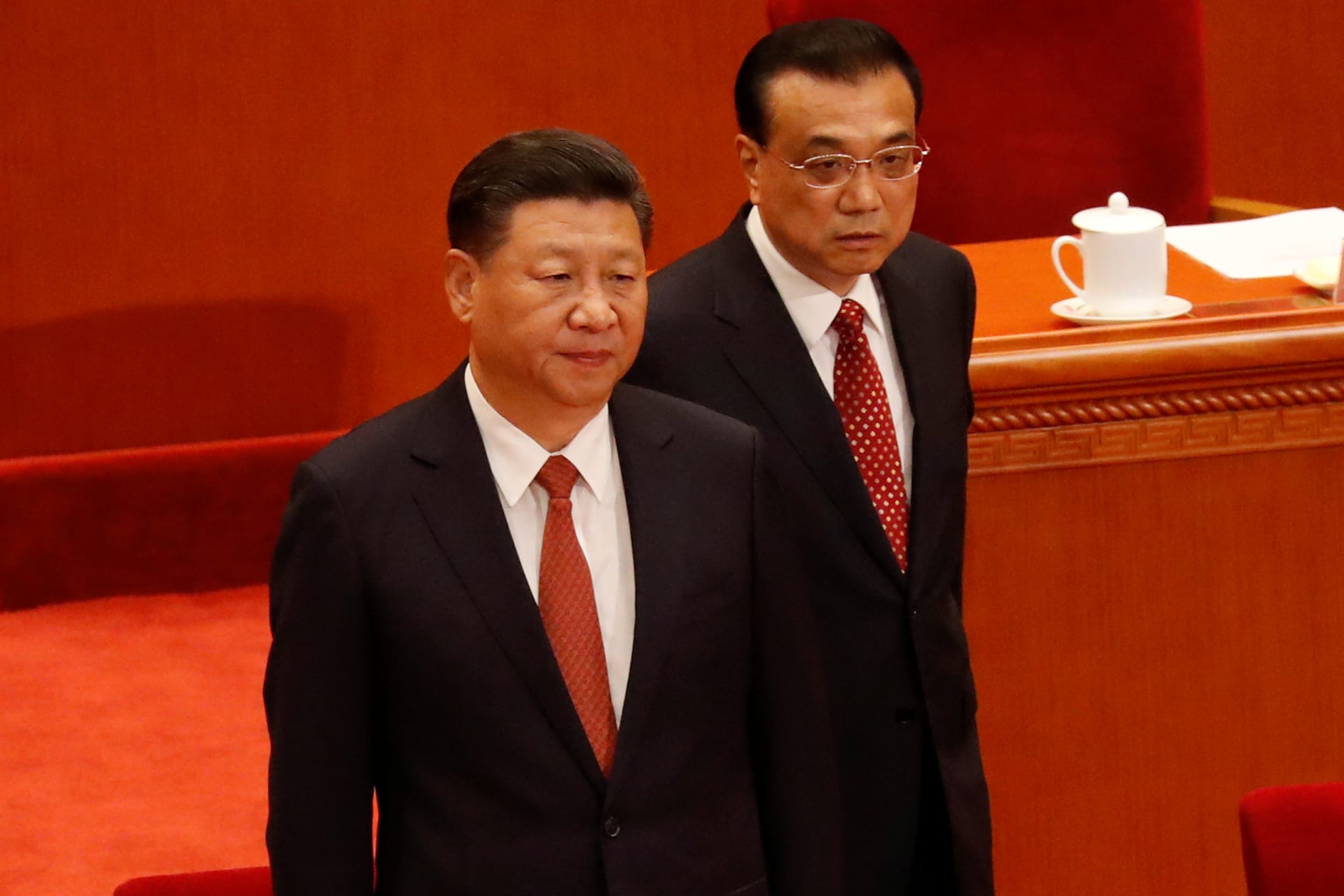 <p>China’s President Xi Jinping and Premier Li Keqiang arrive for the ceremony to mark the 90th anniversary of the founding of the China’s People’s Liberation Army at the Great Hall of the People in Beijing.</p>