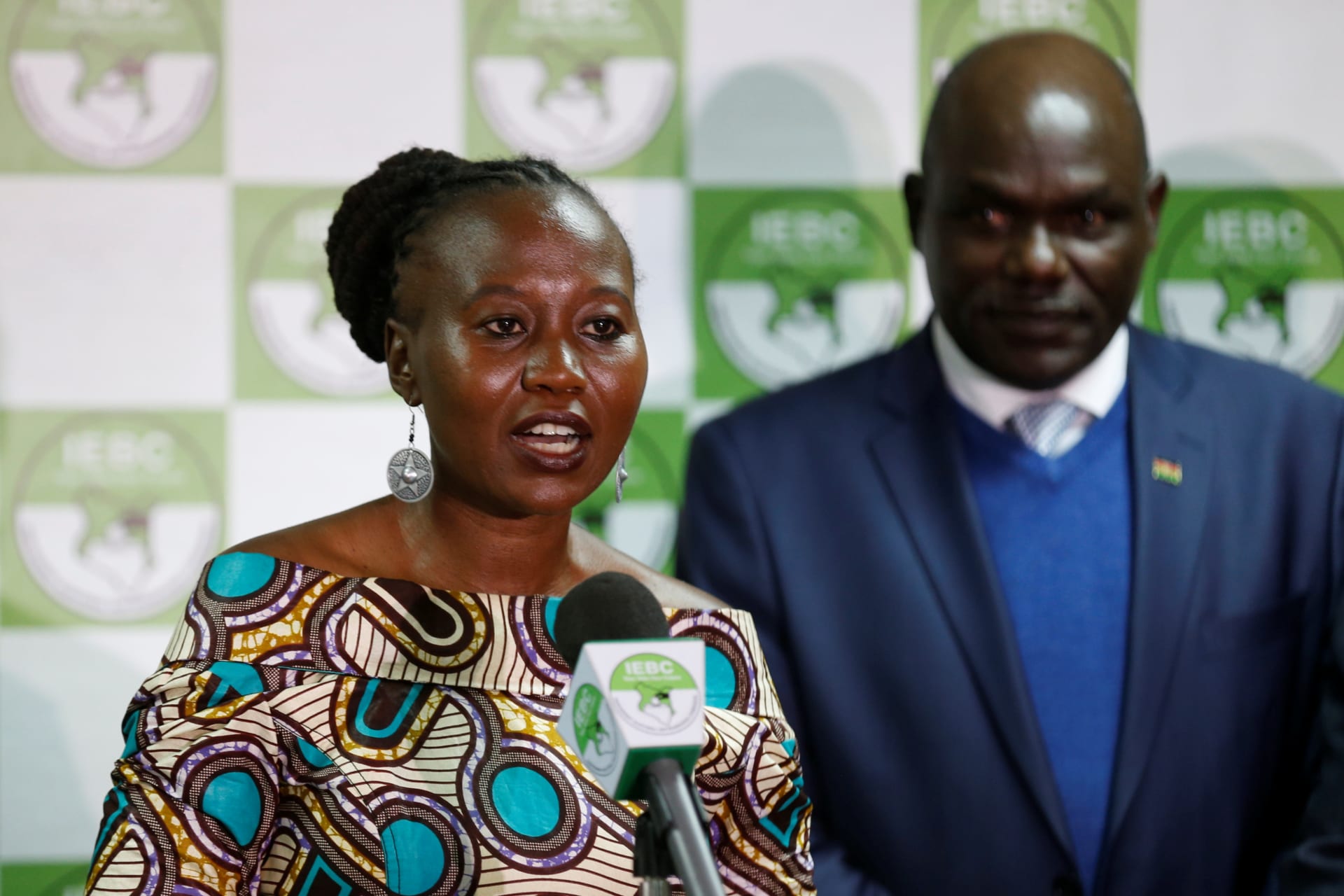 <p>Kenyan IEBC commissioner Roselyn Akombe, who recently fled Kenya after receiving death threats, flanked by chairman Wafula Chebukati, addresses a news conference at their offices in Nairobi, Kenya, July 6, 2017. Picture taken July 6, 2017.</p>
