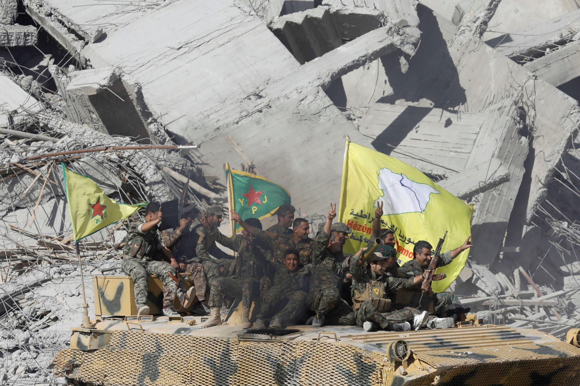 <p>Syrian Democratic Forces fighters celebrate victory in Raqqa.</p>
