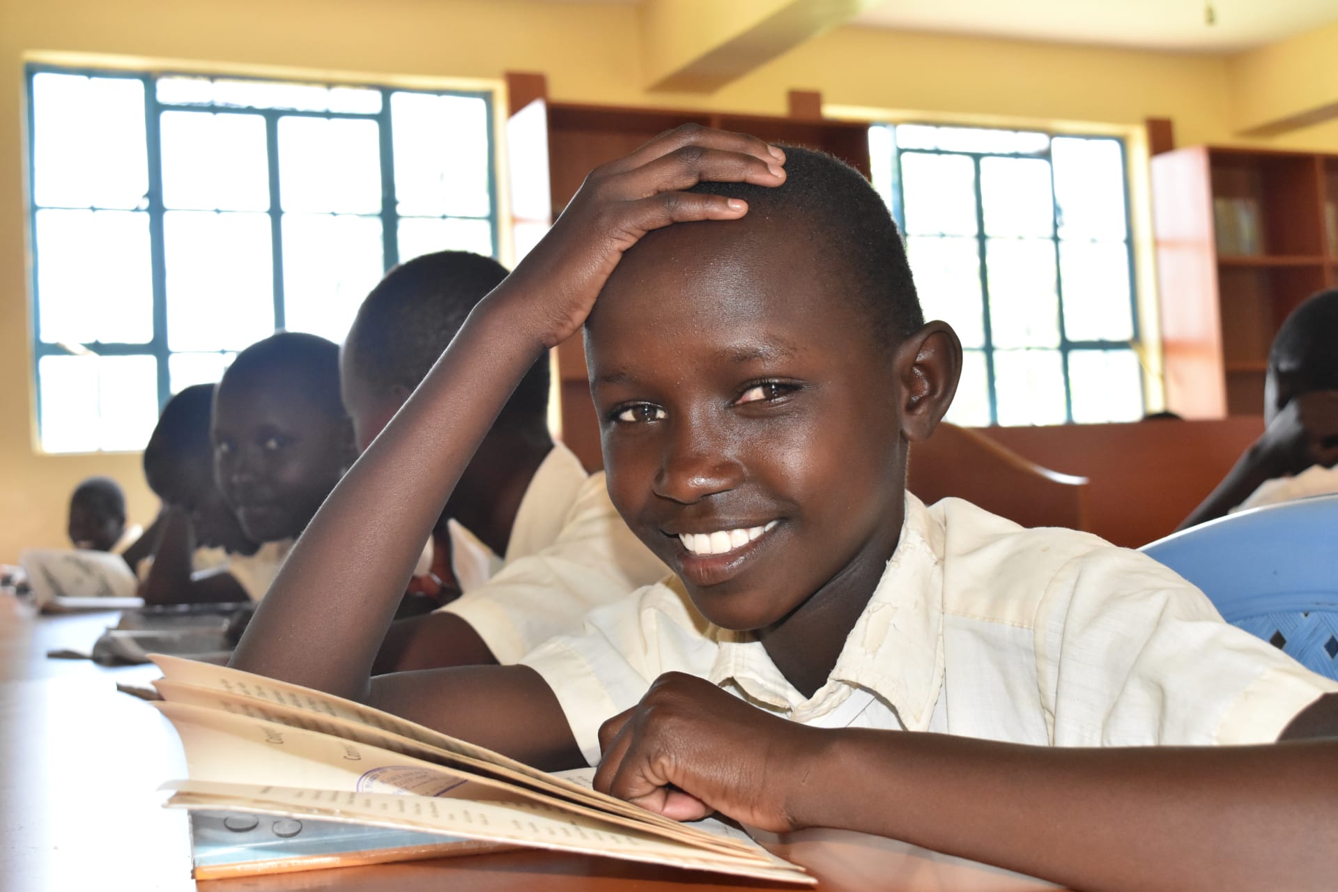 <p>A fourth grade student at Kakenya Center for Excellence reads during English class. </p>