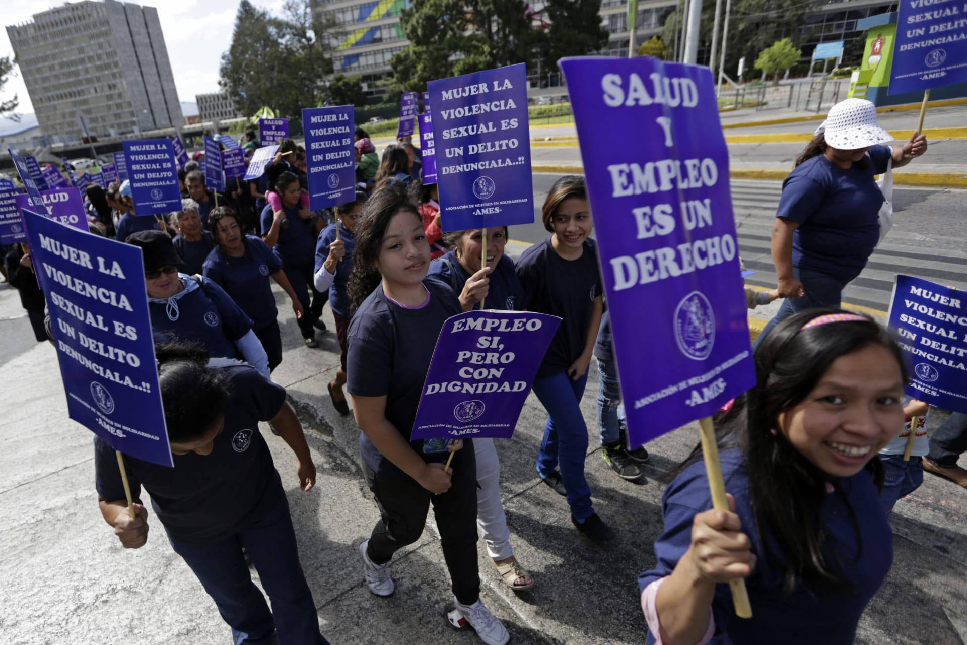 <p>Women take part in a demonstration marking International Women’s Day in Guatemala City March 8, 2015. The signs read, “Health and work are a right” (R) and “Work, yes, but with dignity” (C and L), “Denouncing sexual violence, crimes against women” (top C)</p>
