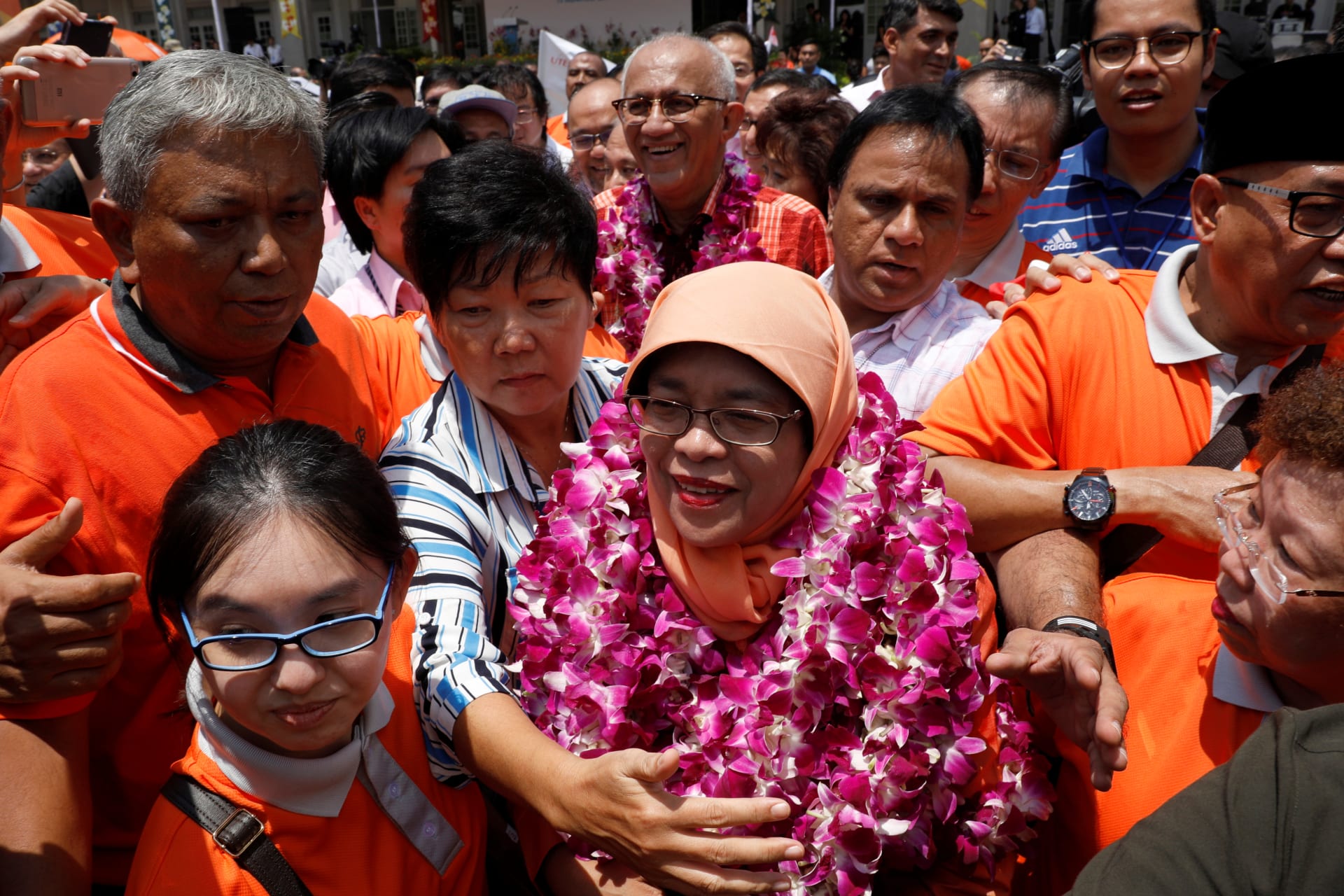 <p>Singapore’s President-elect Halimah Yacob greets supporters as she leaves the nomination centre in Singapore September 13, 2017. </p>
