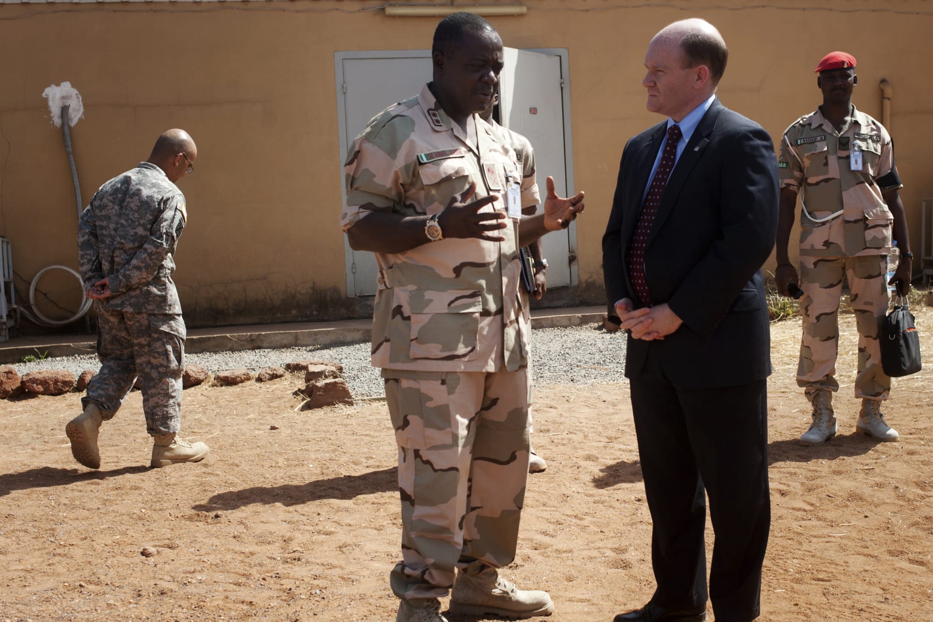 <p>U.S. Senator Chris Coons (C) chats with Force Commander Major General Shehu Abdulkadir on a previous CODEL during President Obama’s administration, in Bamako, Mali, February 18, 2013. </p>
