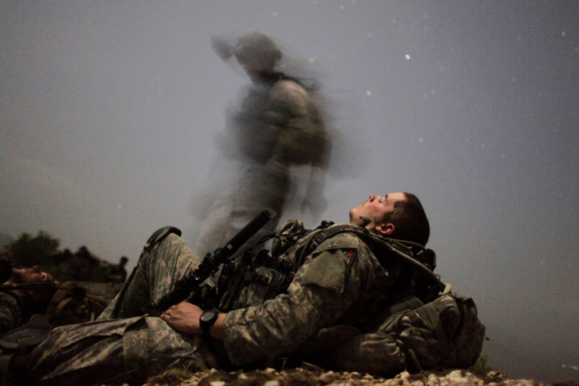 <p>A U.S. soldier takes a break during a night mission in Afghanistan’s Pesh valley.</p>
