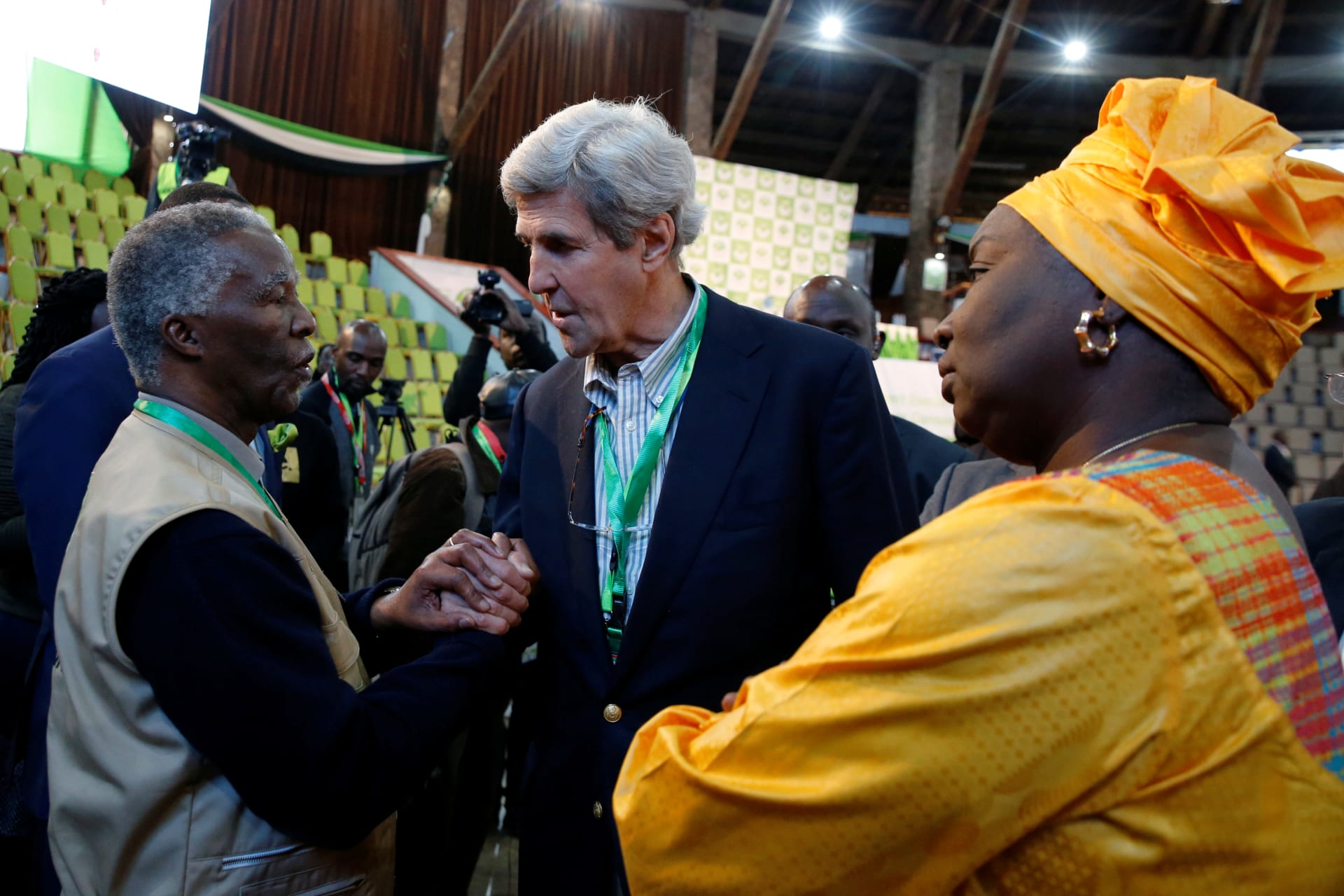<p>Former U.S. Secretary of State John Kerry and former South Africa President Thabo Mbeki, observers for the general election in Kenya, greet each other next to former Senegalese Prime Minister Aminata Toure in a tally centre in Nairobi early August 9, 2017</p>

