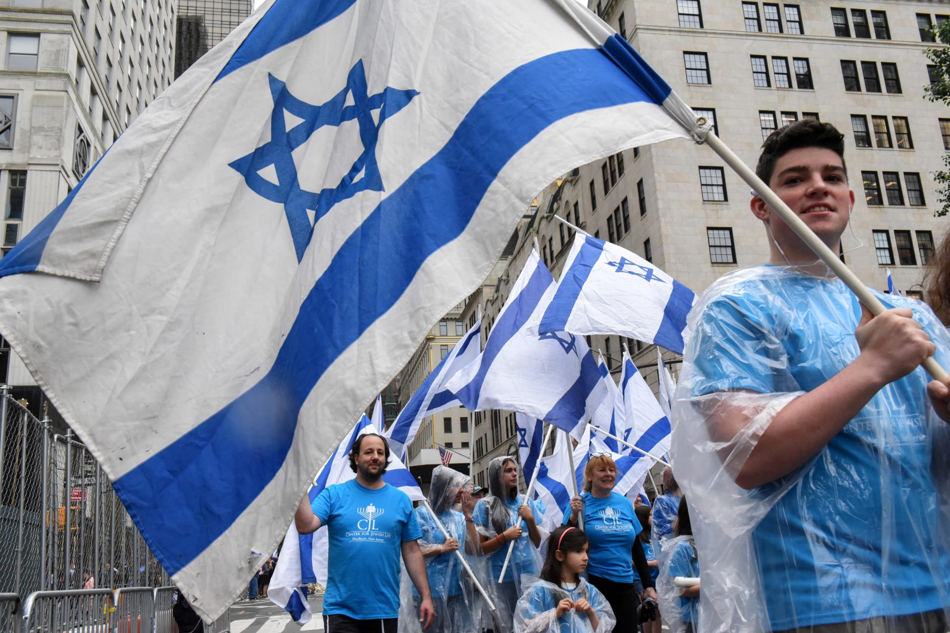 <p>People carry Israeli flags while participating in the “Celebrate Israel” parade along 5th Ave. in New York City (Stephanie Keith/Reuters).</p>
