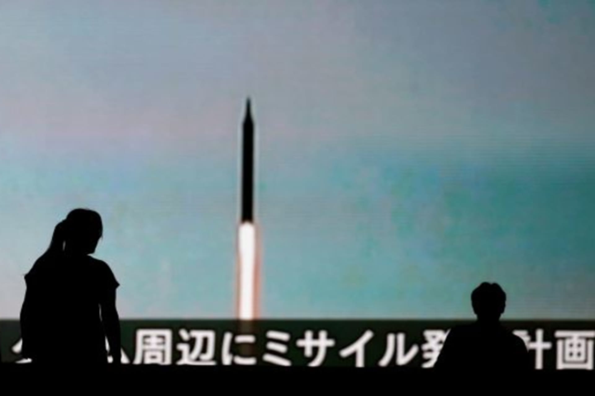 <p>People walk in front of a monitor showing news of North Korea’s fresh threat in Tokyo, Japan, August 10, 2017.</p>
