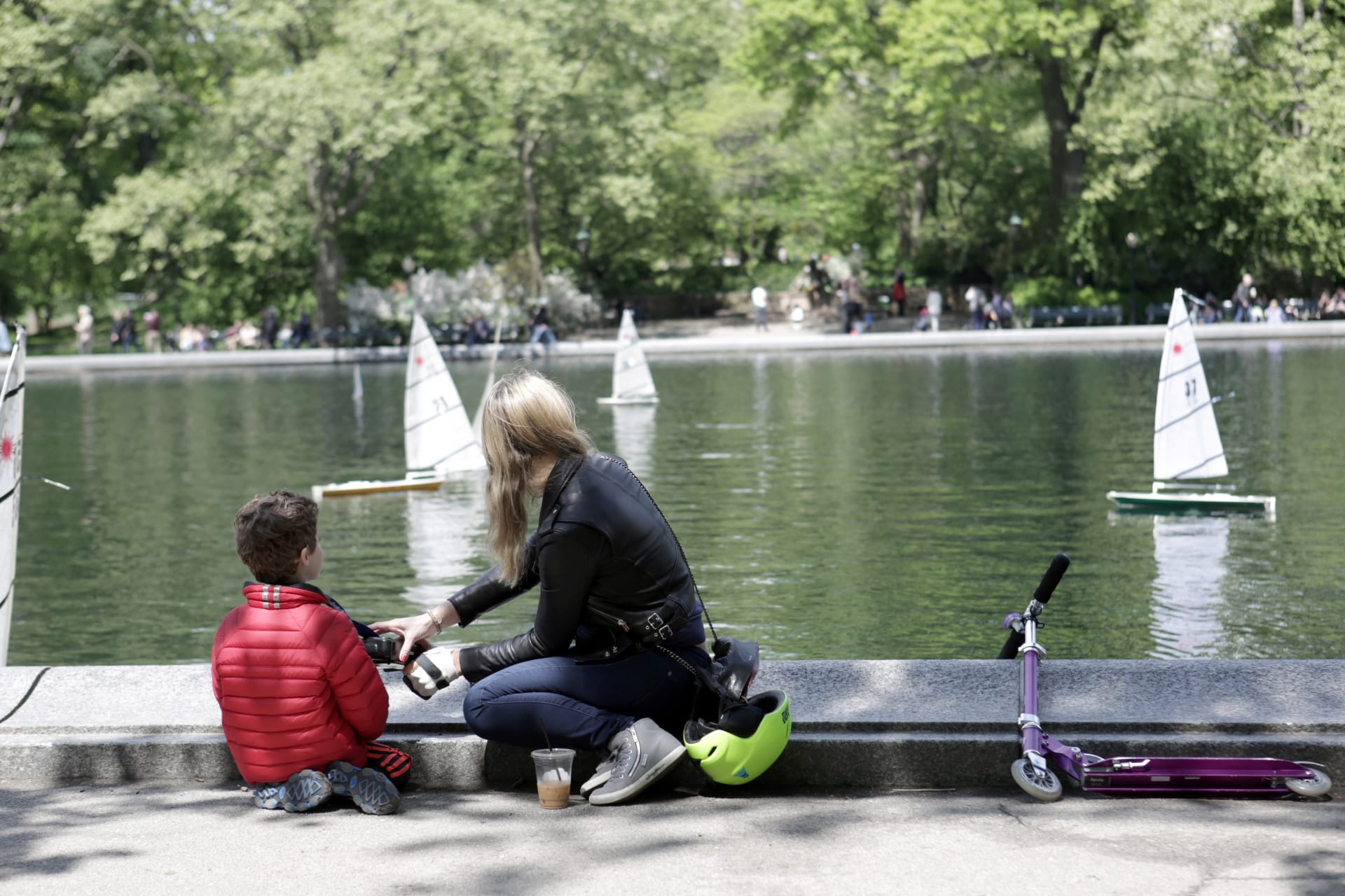 <p>A woman and a child look at miniature sailboats on Mother’s Day in Central Park, New York City, U.S., May 14, 2017. </p>
