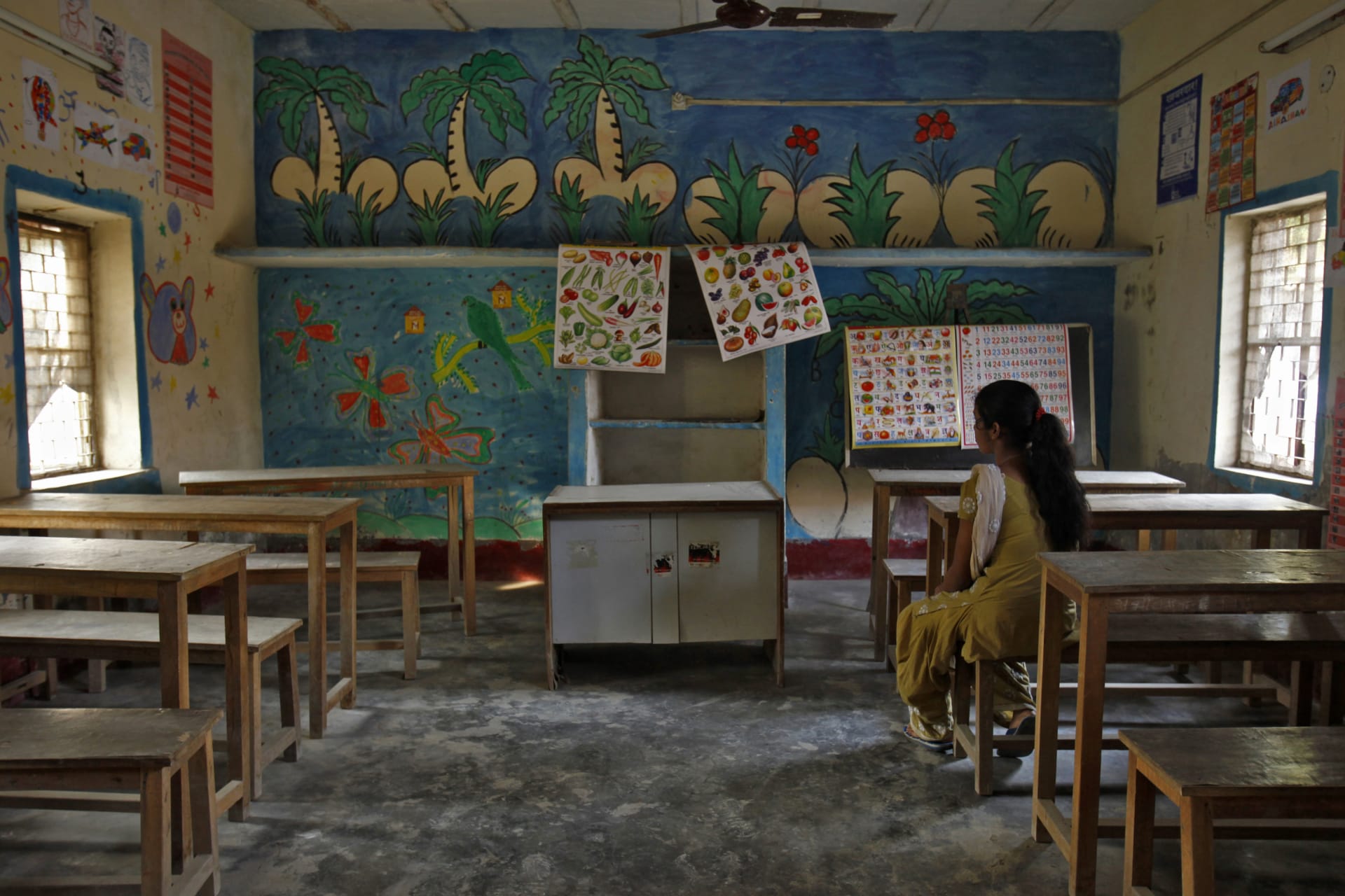<p>A 16-year-old girl sits inside a protection home on the outskirts of New Delhi November 9, 2012. She was working as a maid was rescued by Bachpan Bachao Andolan (Save the Childhood Movement), a charity which rescues victims of bonded labour. </p>
