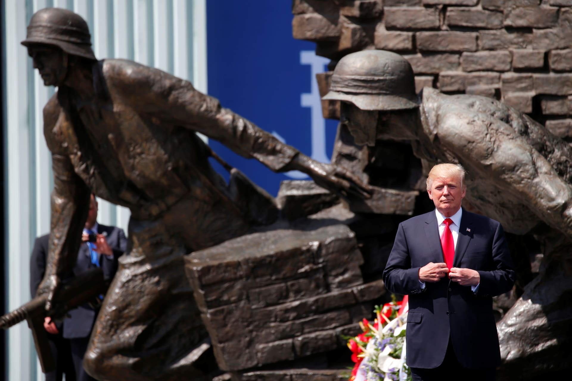<p>U.S. President Donald J. Trump gestures after his public speech in front of the Warsaw Uprising Monument at Krasinski Square, in Warsaw, Poland, on July 6, 2017.</p>

