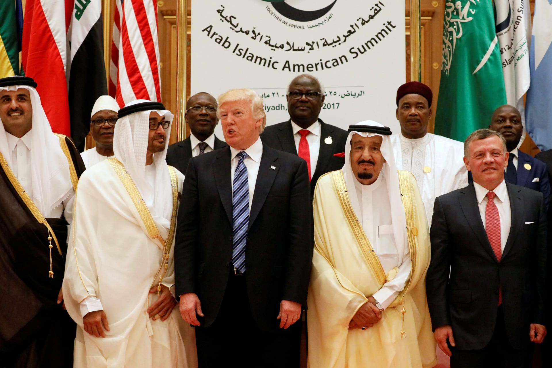 <p>(Front R-L) Jordan’s King Abdullah II, Saudi Arabia’s King Salman, U.S. President Donald Trump, Abu Dhabi Crown Prince Sheikh Mohammed bin Zayed al-Nahyan and Qatar’s Emir Sheikh Tamim Bin Hamad Al-Thani pose for a photo (Jonathan Ernst/Reuters).</p>
