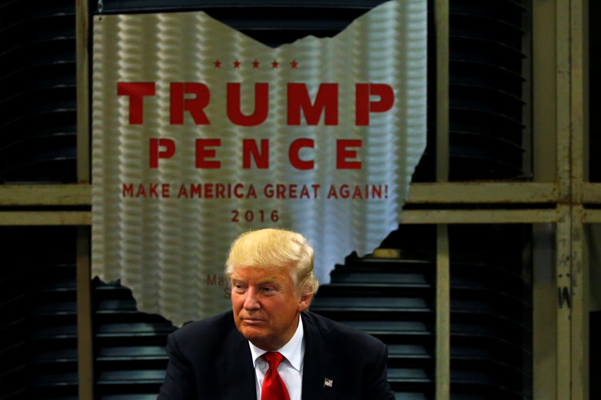 <p>Donald Trump sits beneath a steel emblem in the shape of the state of Ohio as he holds a business roundtable at the Staub Manufacturing plant in Dayton, Ohio.</p>
