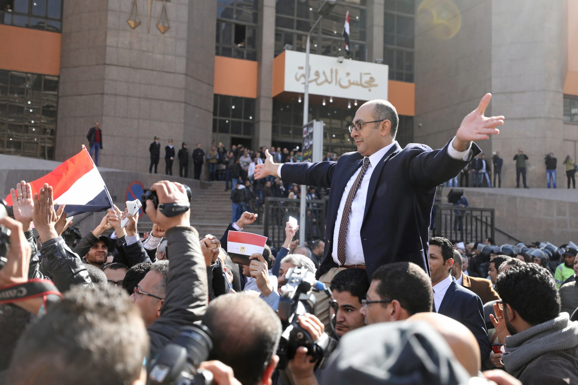 <p>Egyptian lawyer and ex-presidential candidate Khaled Ali (center), who is marching in support of a ruling against the Egypt-Saudi border demarcation agreement, reacts in front of the State Council courthouse in Cairo (Mohamed Abdel Ghany/Reuters).</p>