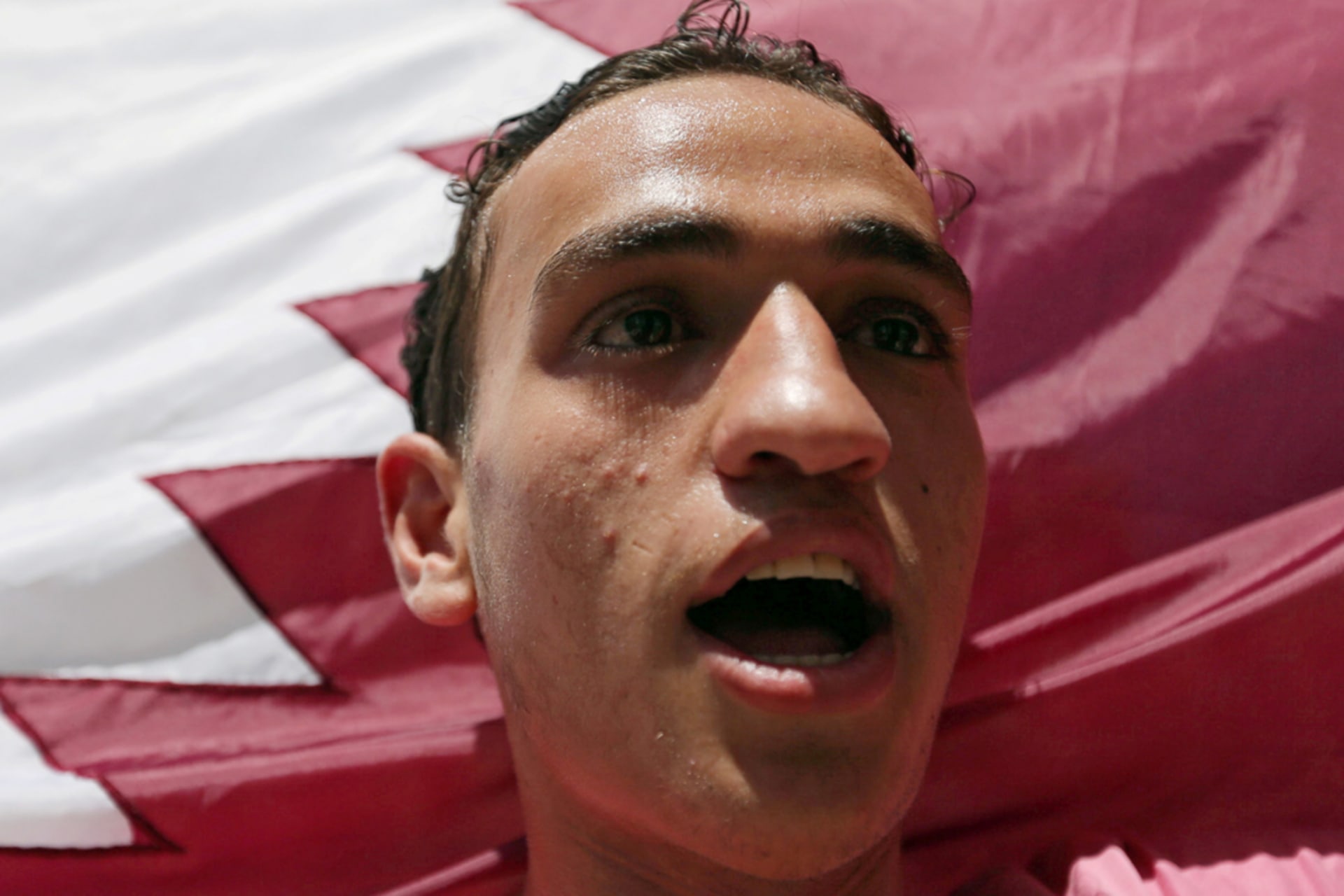 <p>A Palestinian man holds a Qatari flag during a rally in support of Qatar, inside Qatari-funded construction project ‘Hamad City’, in the southern Gaza Strip June 9, 2017.</p>
