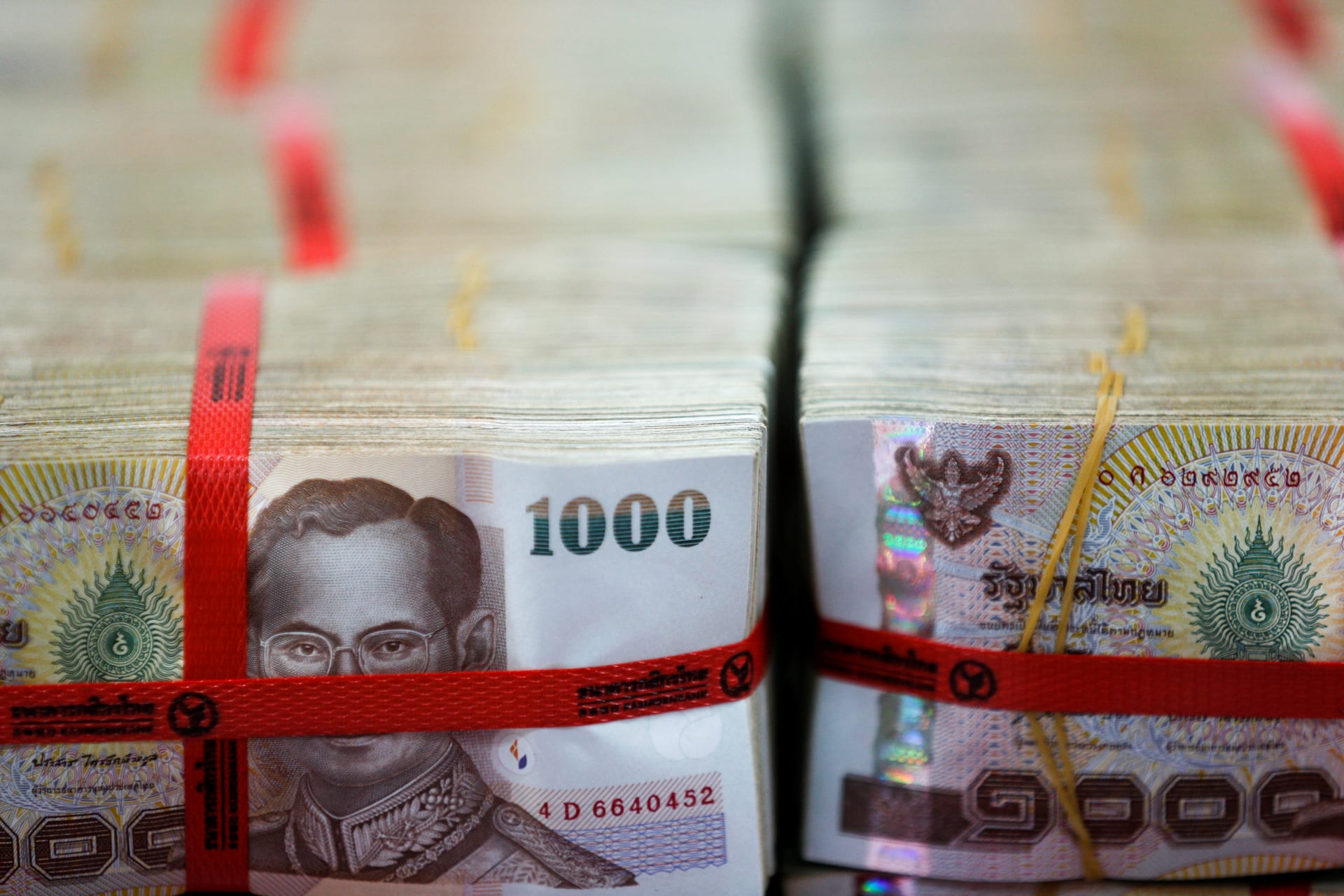 <p>Thai baht notes are seen at a Kasikornbank in Bangkok, Thailand, on May 12, 2016. </p>
