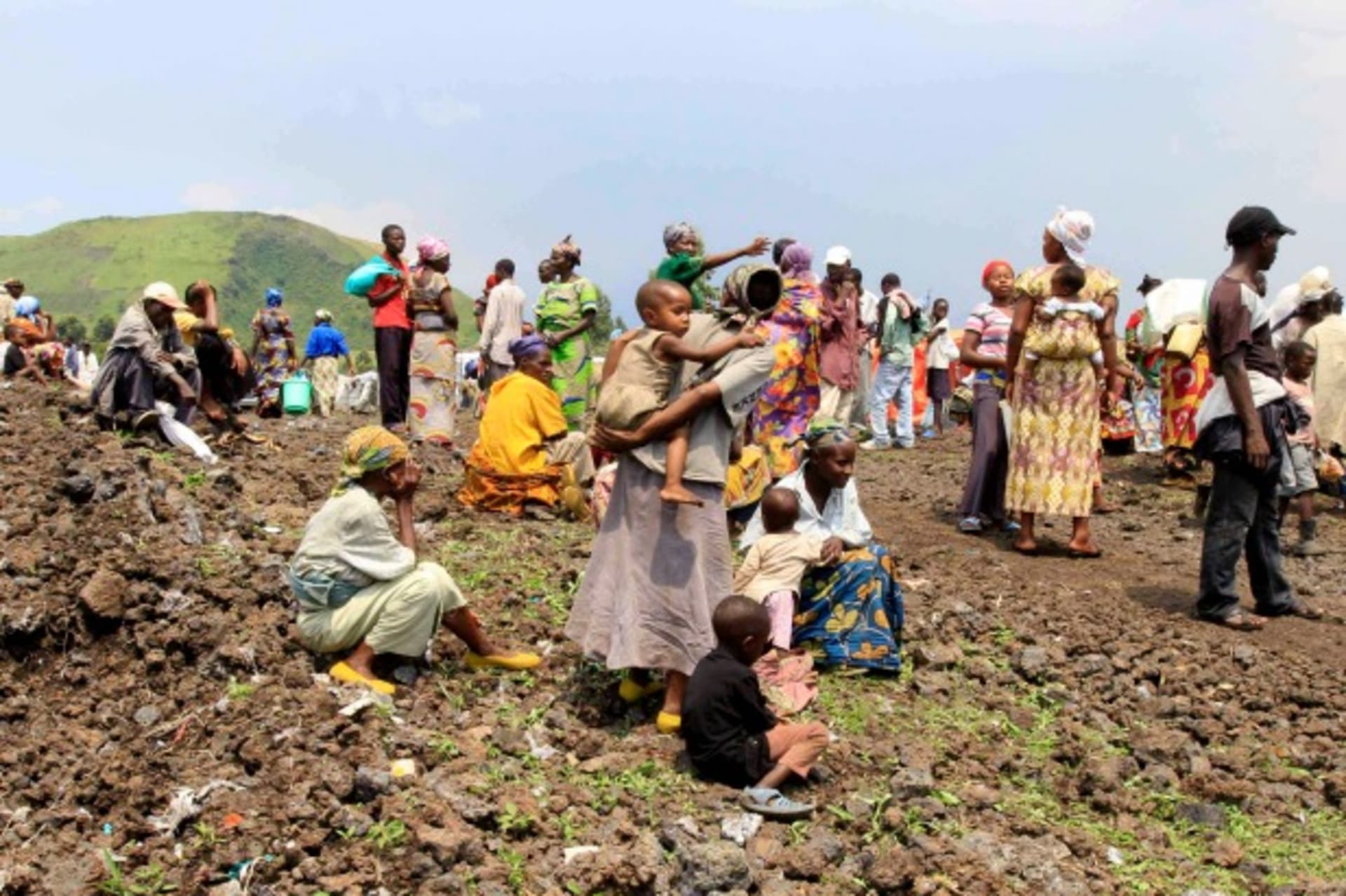 <p>People displaced by recent fighting in eastern Congo wait for relief aid in Mugunga IDP camp outside of Goma, November 24, 2012.</p>
