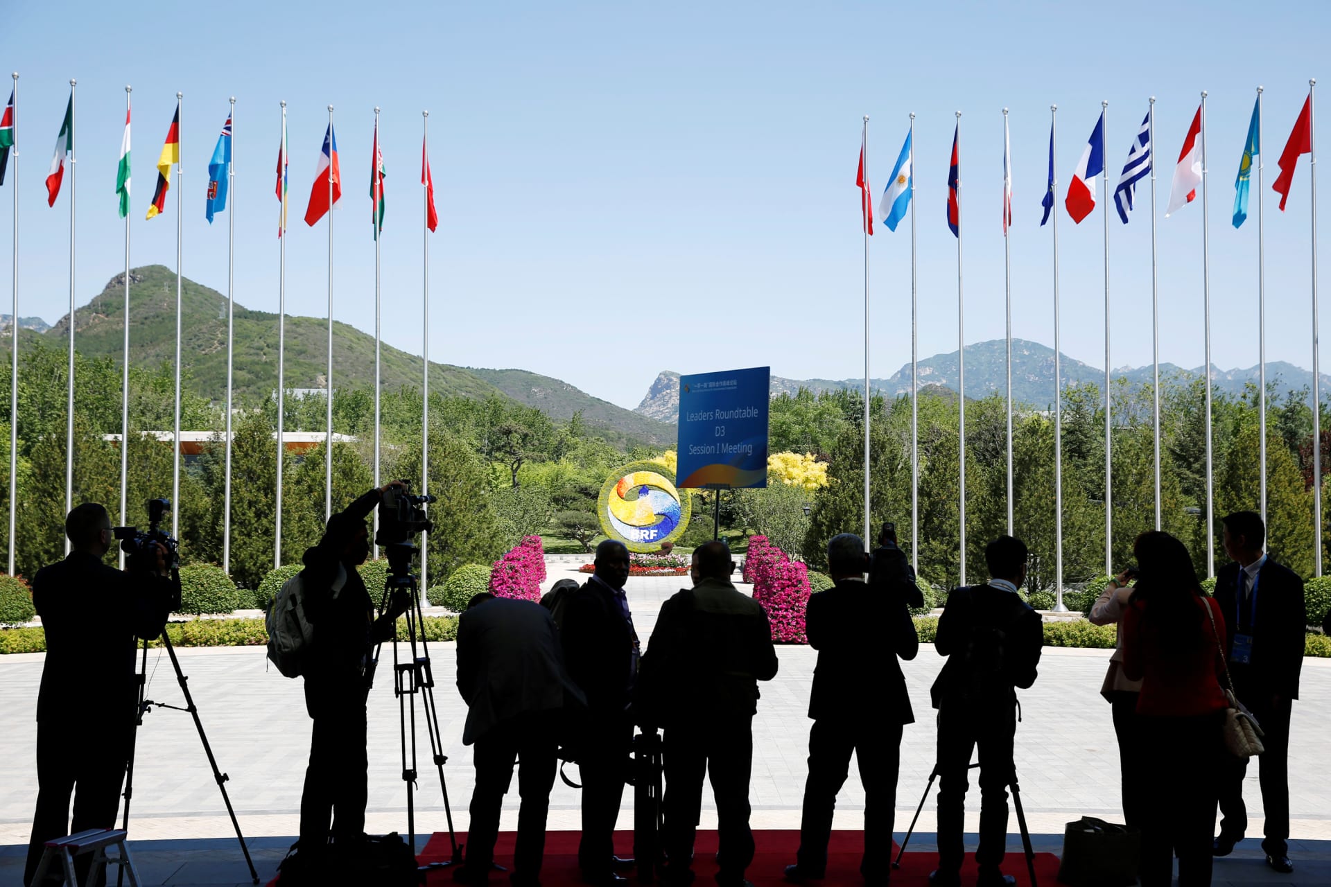 <p>Journalists take pictures outside the venue of a summit at the Belt and Road Forum in Beijing, China, May 15, 2017.</p>
