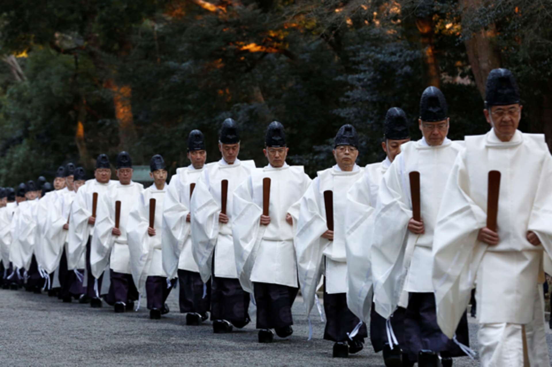 <p>Shinto priests walk in a line to attend a ritual to usher in the upcoming New Year at the Meiji Shrine in Tokyo, Japan on December 31, 2016.</p>
