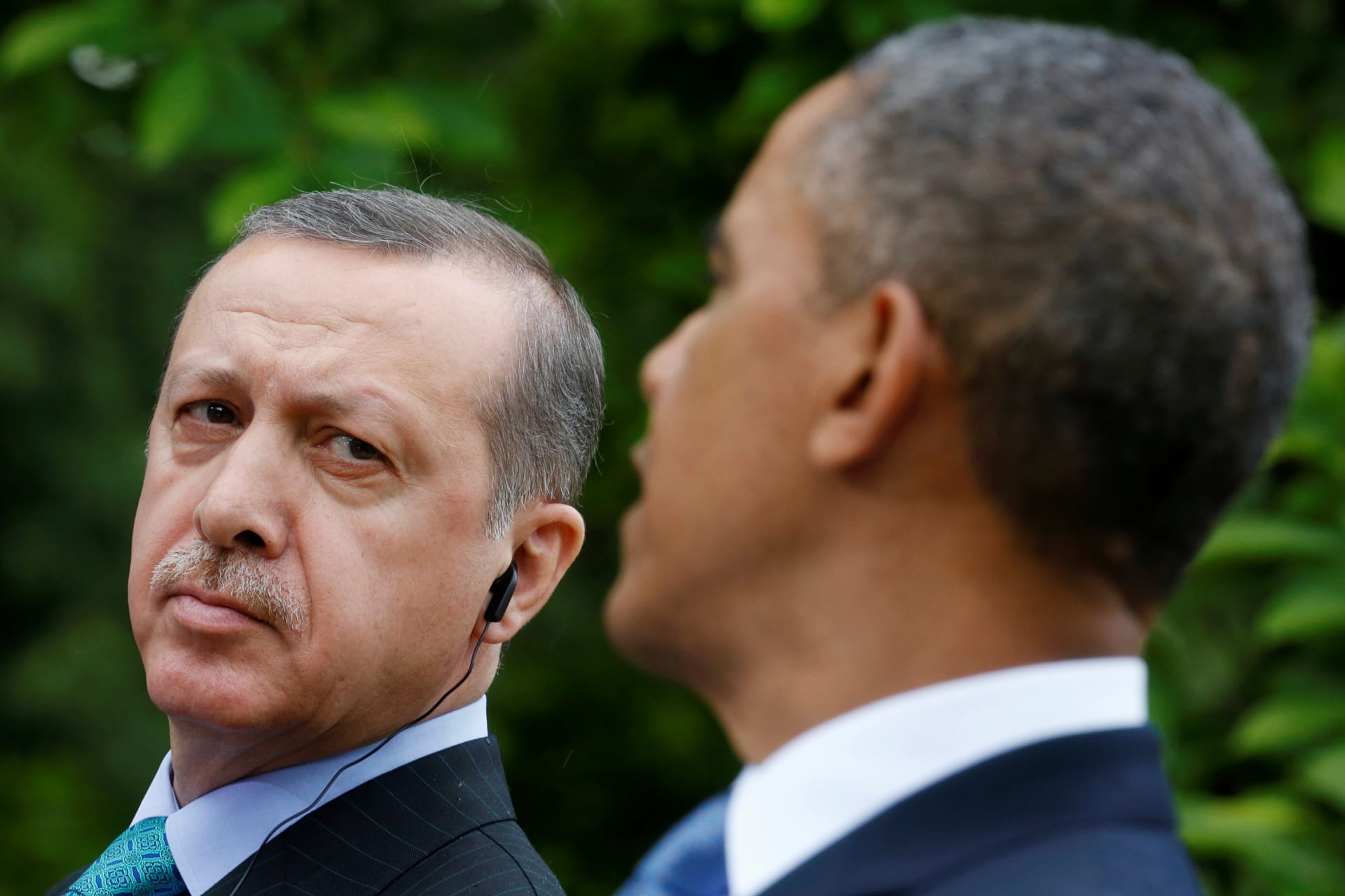 <p>Turkish Prime Minister Recep Tayyip Erdogan (L) listens as U.S. President Barack Obama (R) addresses a joint news conference in the White House Rose Garden in Washington (Kevin Lamarque/Reuters).</p>