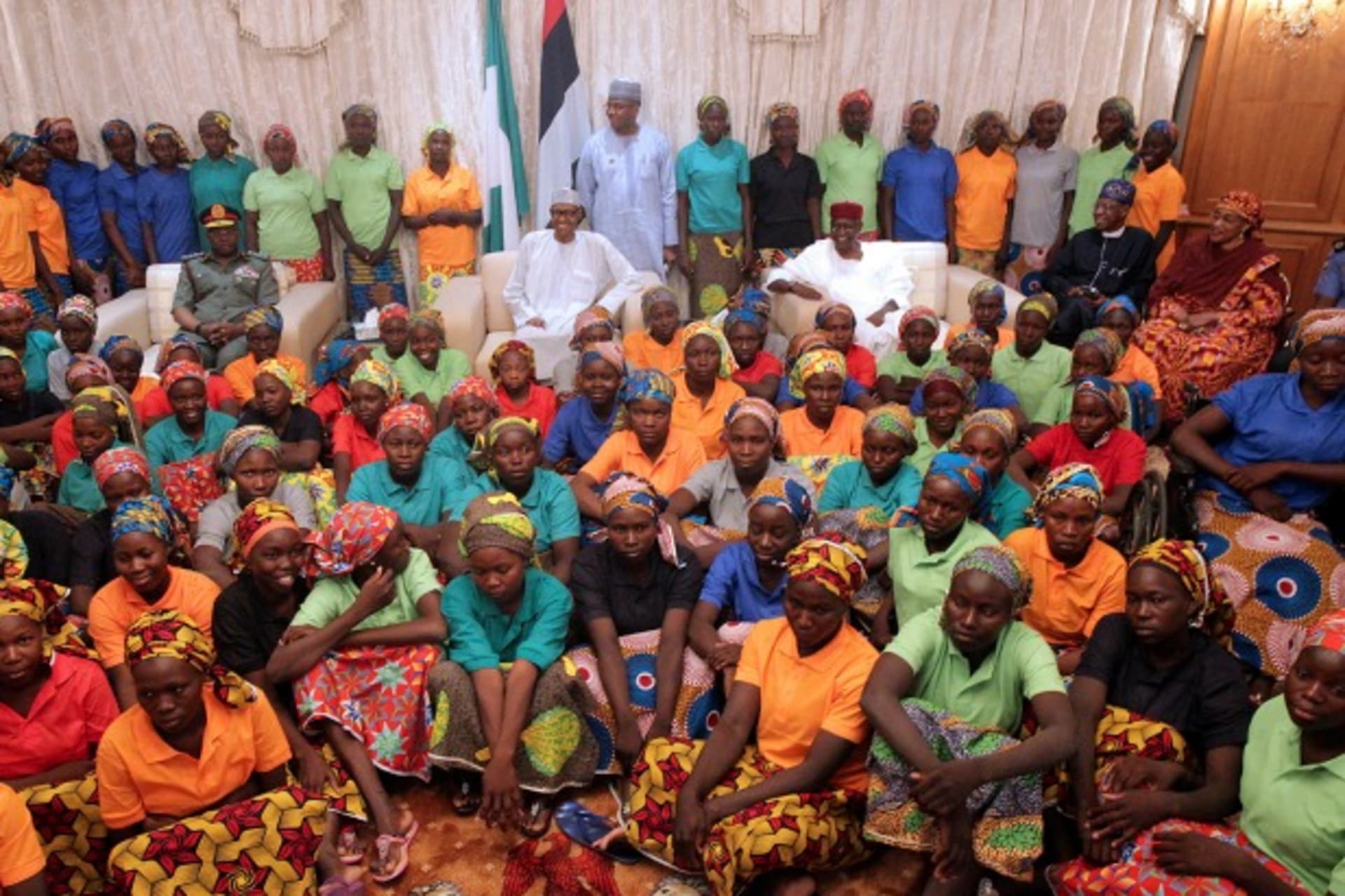<p>Nigeria’s President Muhammadu Buhari smiles as he welcomes a group of Chibok girls, who were held captive for three years by the millitant group Boko Haram, in Abuja, Nigeria, May 7, 2017. </p>
