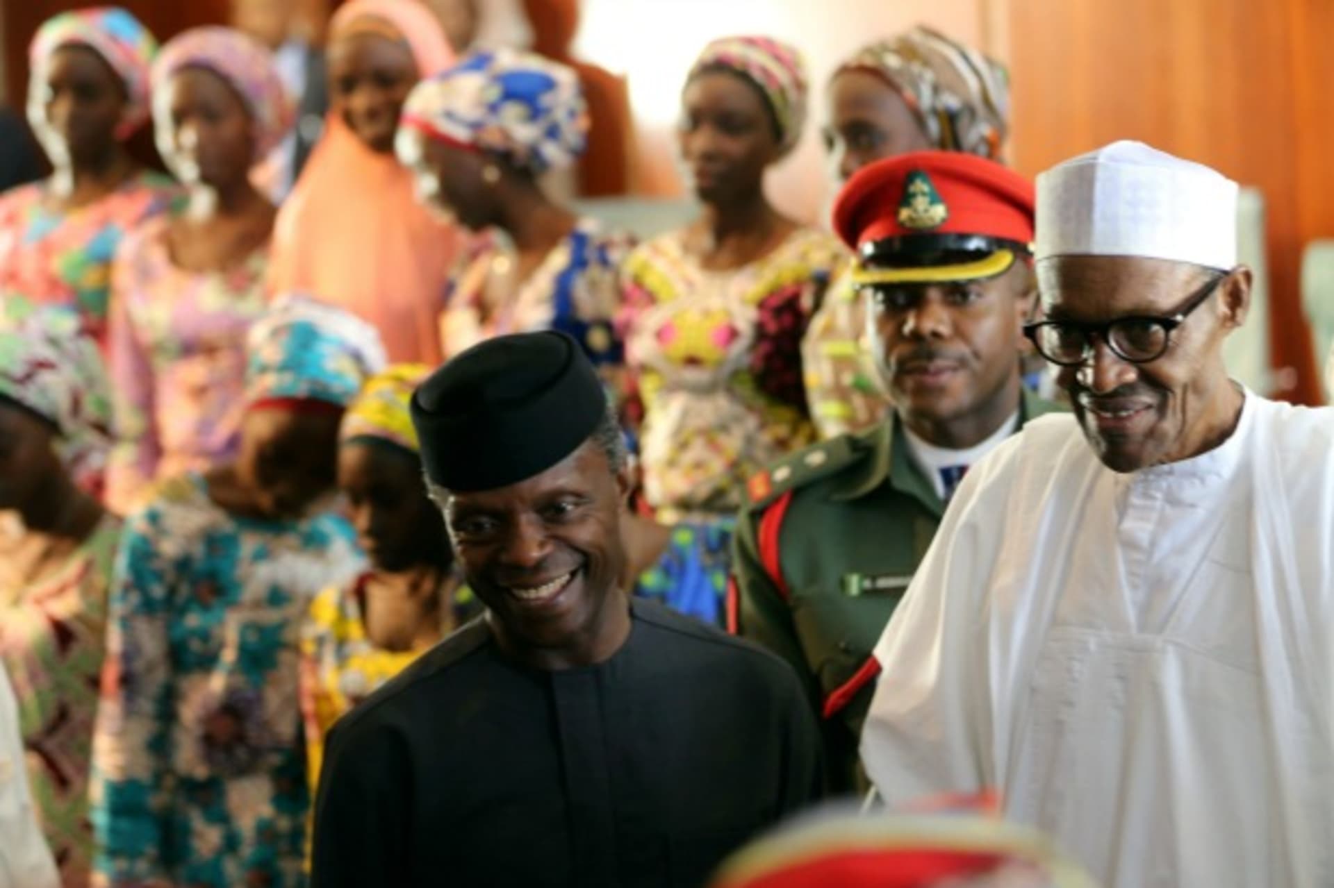 <p>President Muhammadu Buhari and Vice President Yemi Osinbajo receive the 21 Chibok school girls released by Boko Haram, in Abuja, Nigeria, October 19, 2016. </p>
