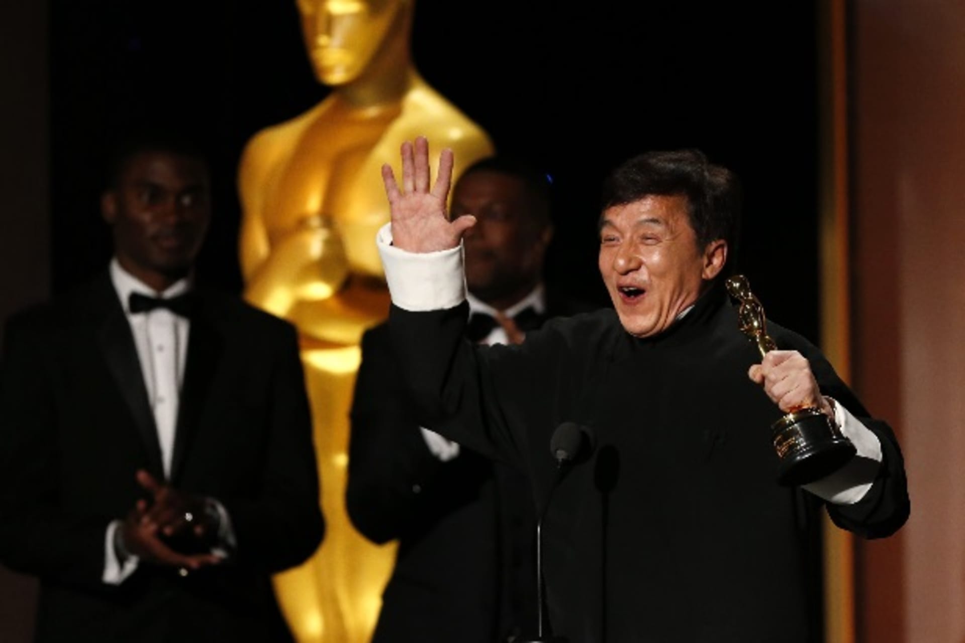 <p>Actor Jackie Chan reacts as he accepts his honorary award as actor Chris Tucker (C) looks on at the 8th Annual Governors Awards in Los Angeles, California on U.S., November 12, 2016. </p>
