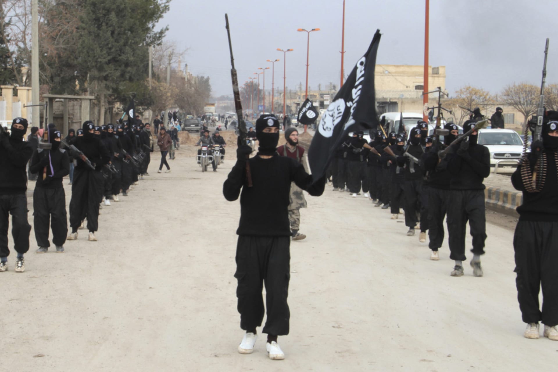 <p>Islamic State militants parade in Tel Abyad, near Syria’s border with Turkey.</p>
