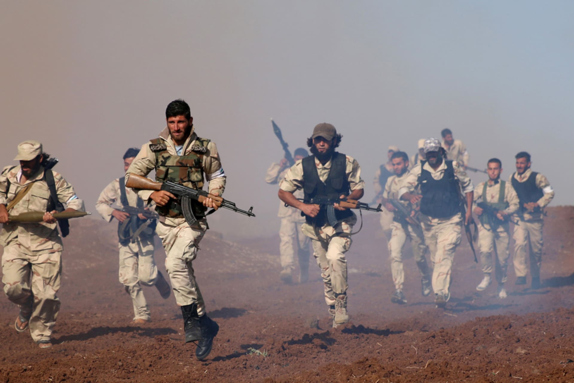 <p>Rebel fighters train in western Deraa governorate.</p>
