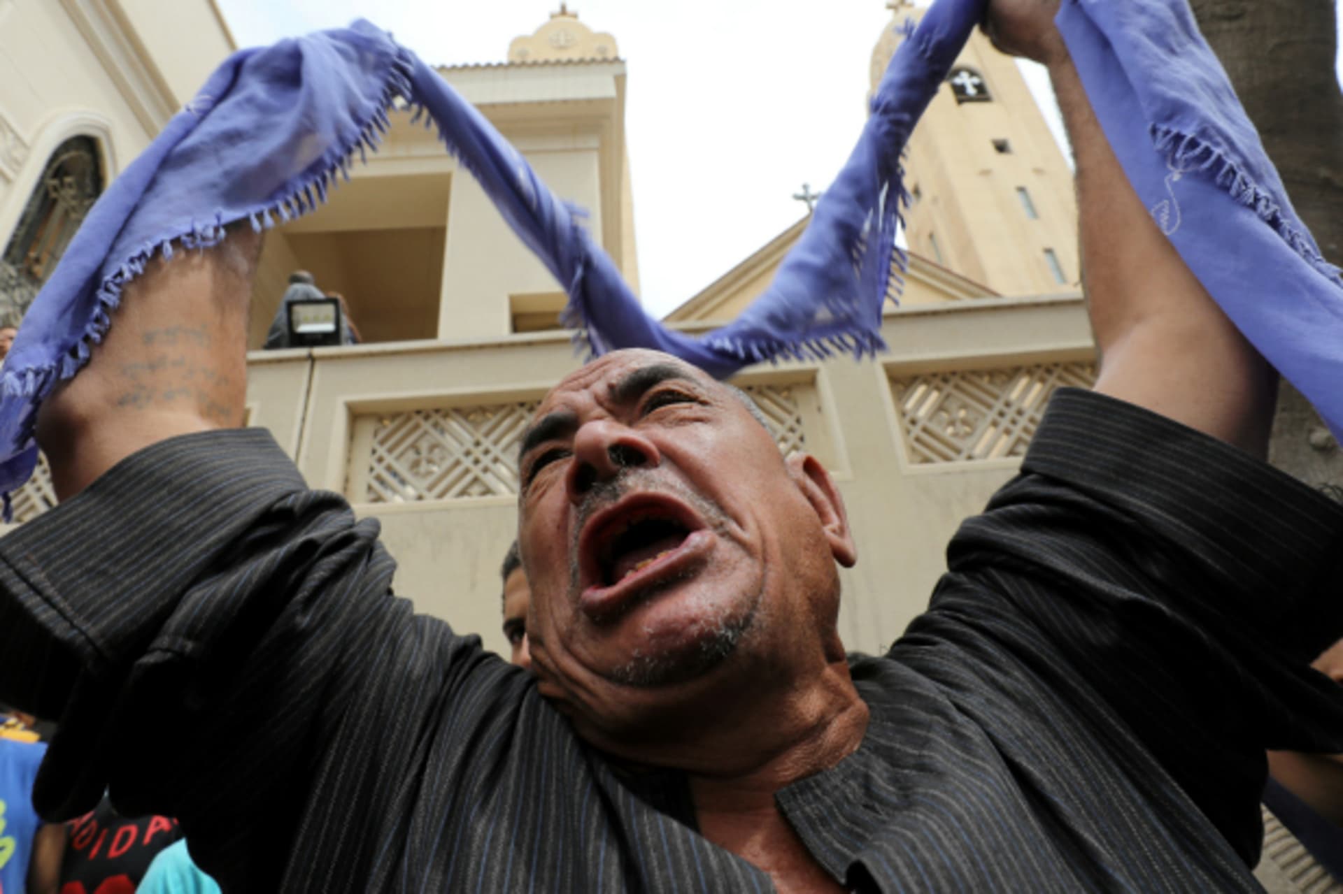 <p>A relative of one of the victims reacts after a church explosion killed at least 21 in Tanta, Egypt (Mohamed Abd El Ghany/Reuters).</p>
