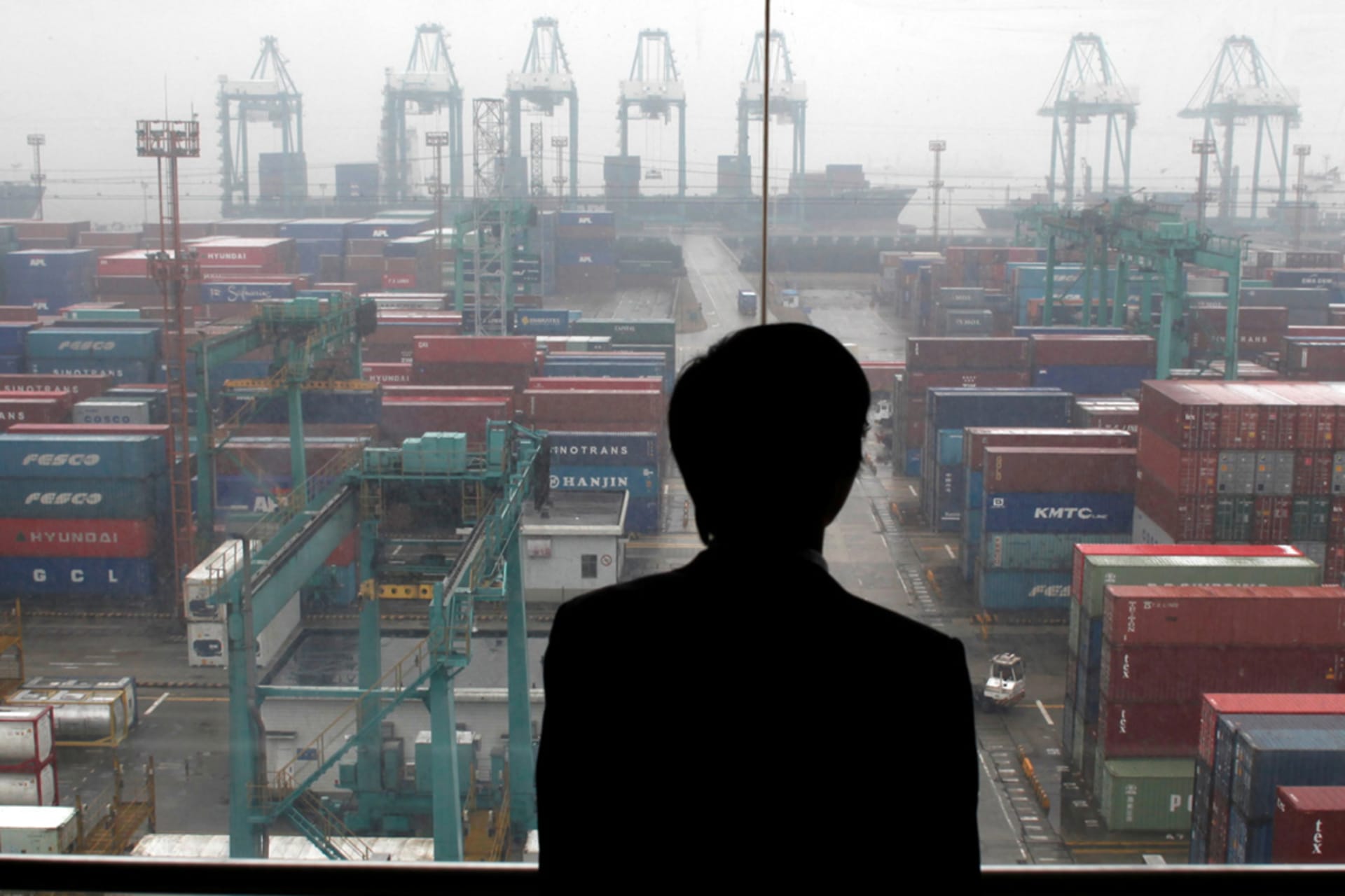 <p>An employee surveys shipping container traffic at the Port of Shanghai. </p>
