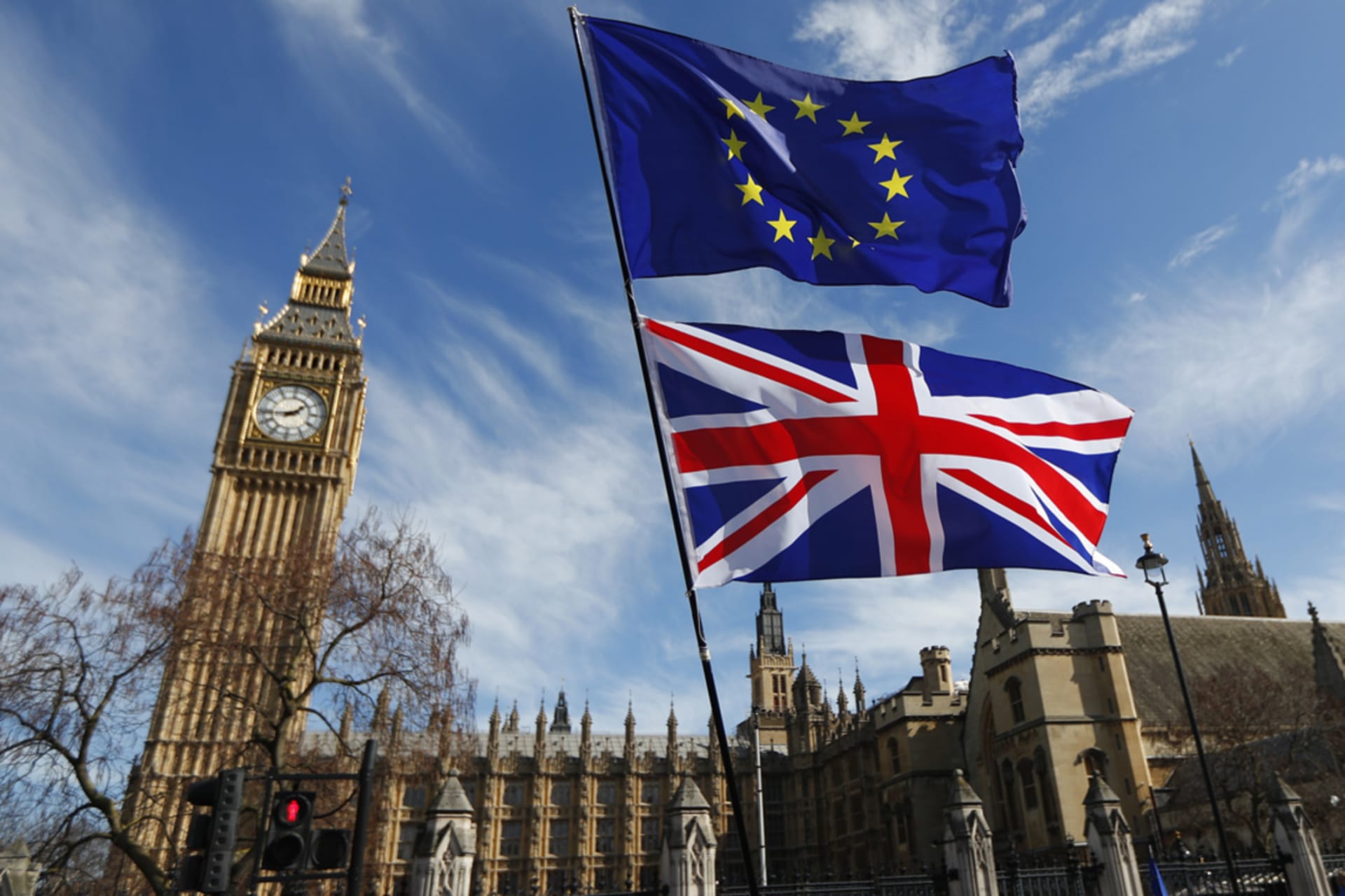 <p>EU and UK flags fly during a pro-EU march in front of the British Parliament in London.</p>