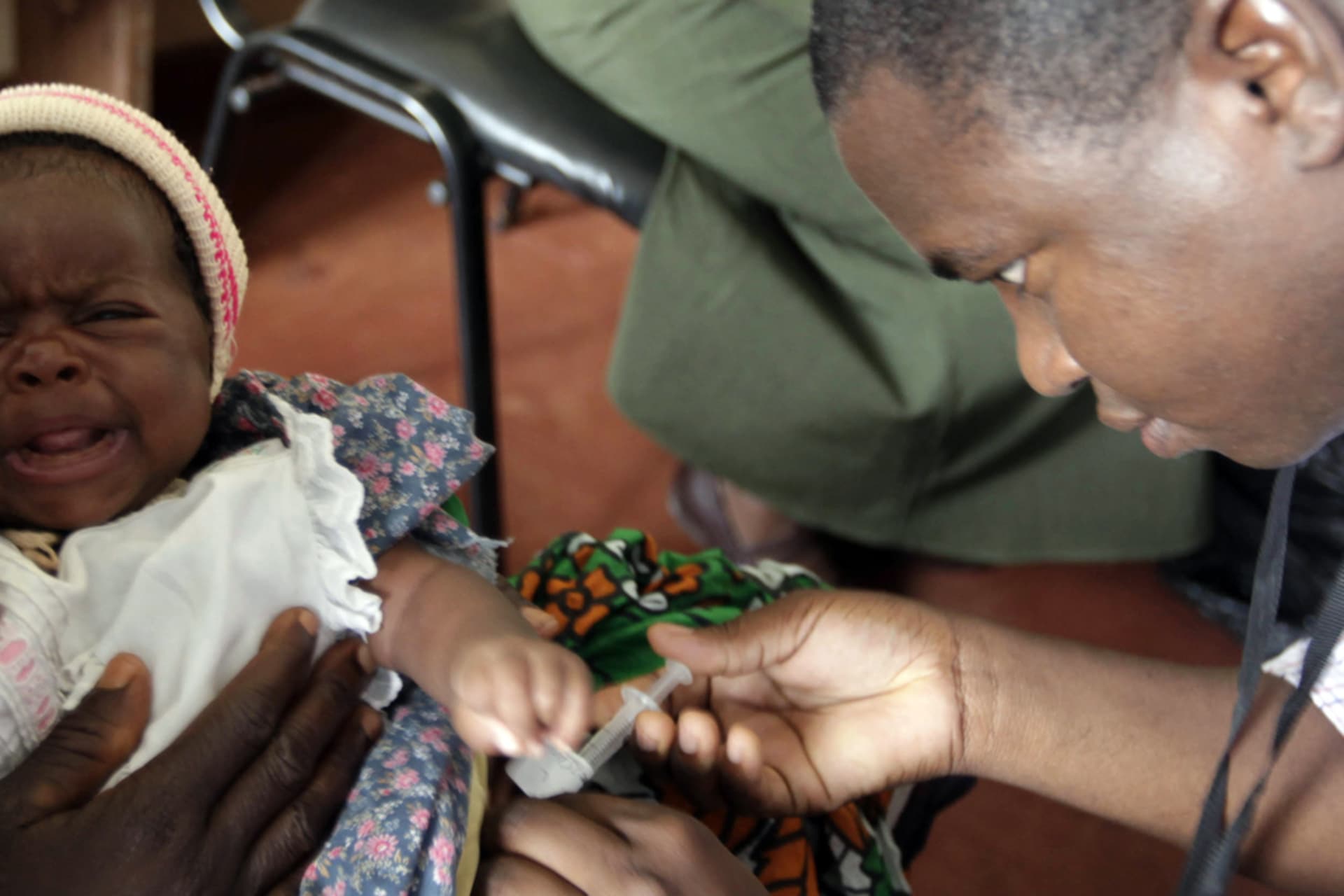 <p>A child is given an injection as part of a malaria vaccine trial at a clinic in Kilifi, Kenya.</p>
