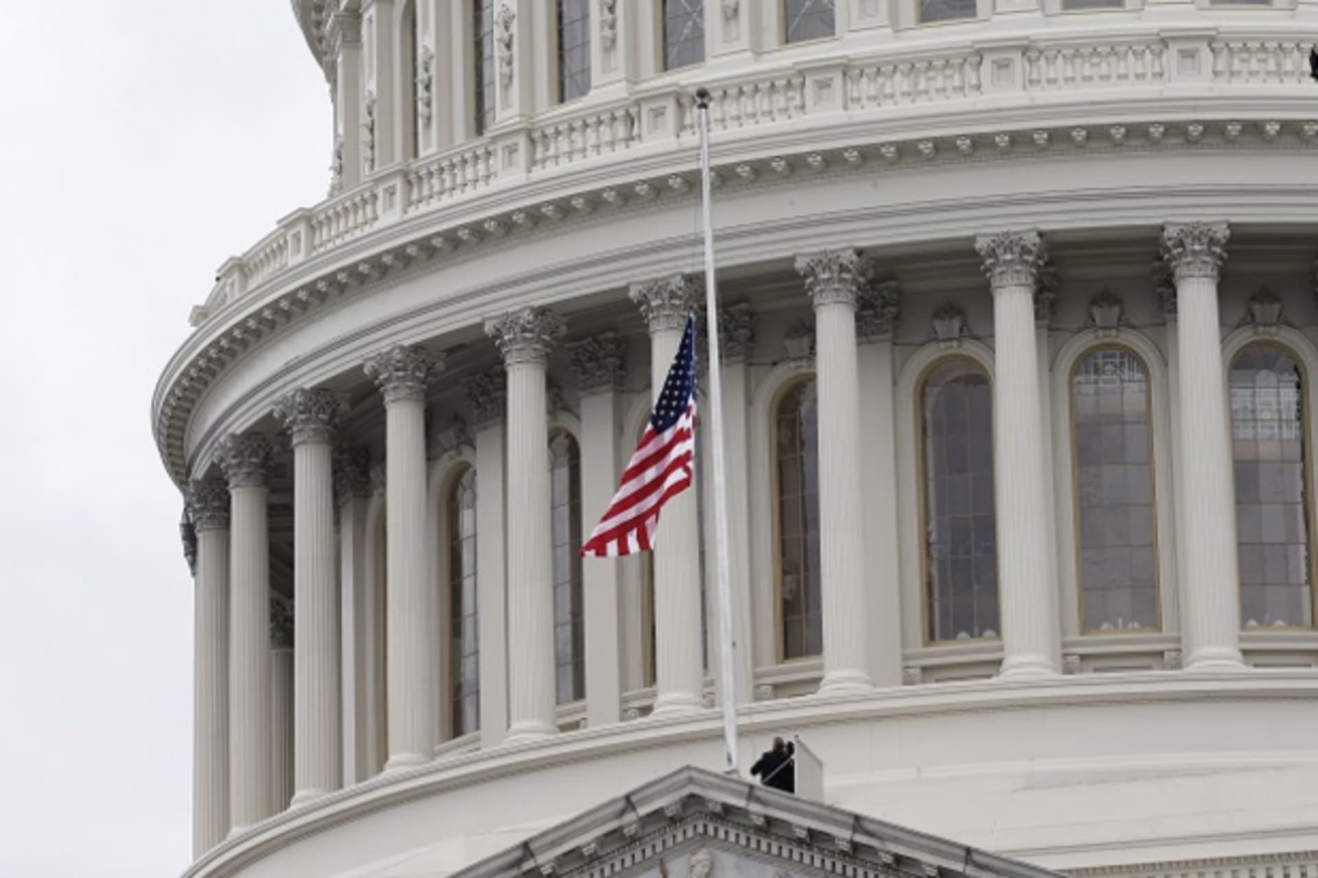 The American flag is changed for a new one on the Capitol building during inauguration ceremonies swearing in Donald Trump as the 45th president of the United States on the West front of the U.S. Capitol in Washington