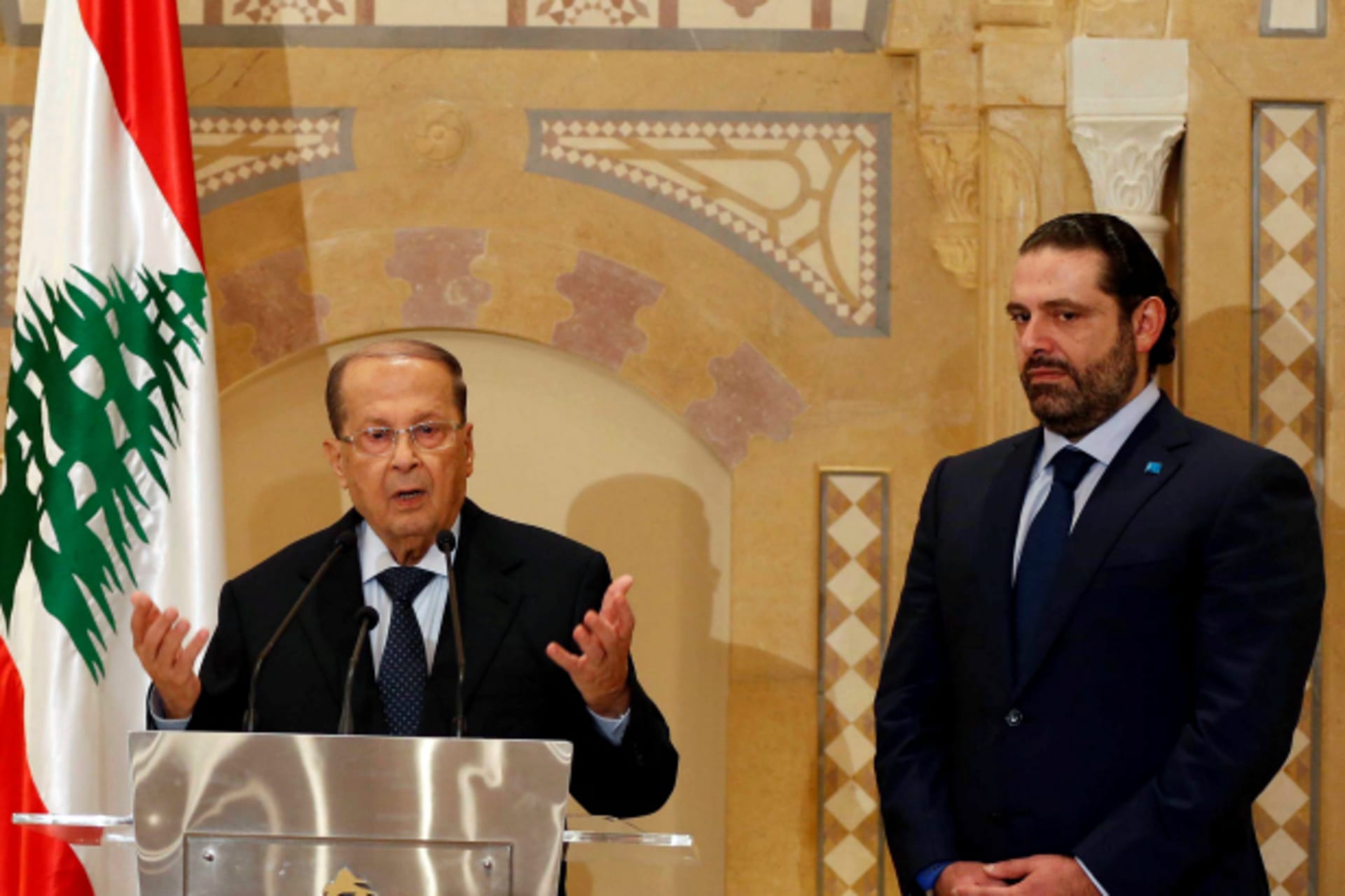 <p>Christian politician and FPM founder Michel Aoun (L) talks during a news conference next to Lebanon’s former prime minister Saad al-Hariri after he said he will back Aoun to become president in Beirut, Lebanon (Mohamed Azakir).</p>

