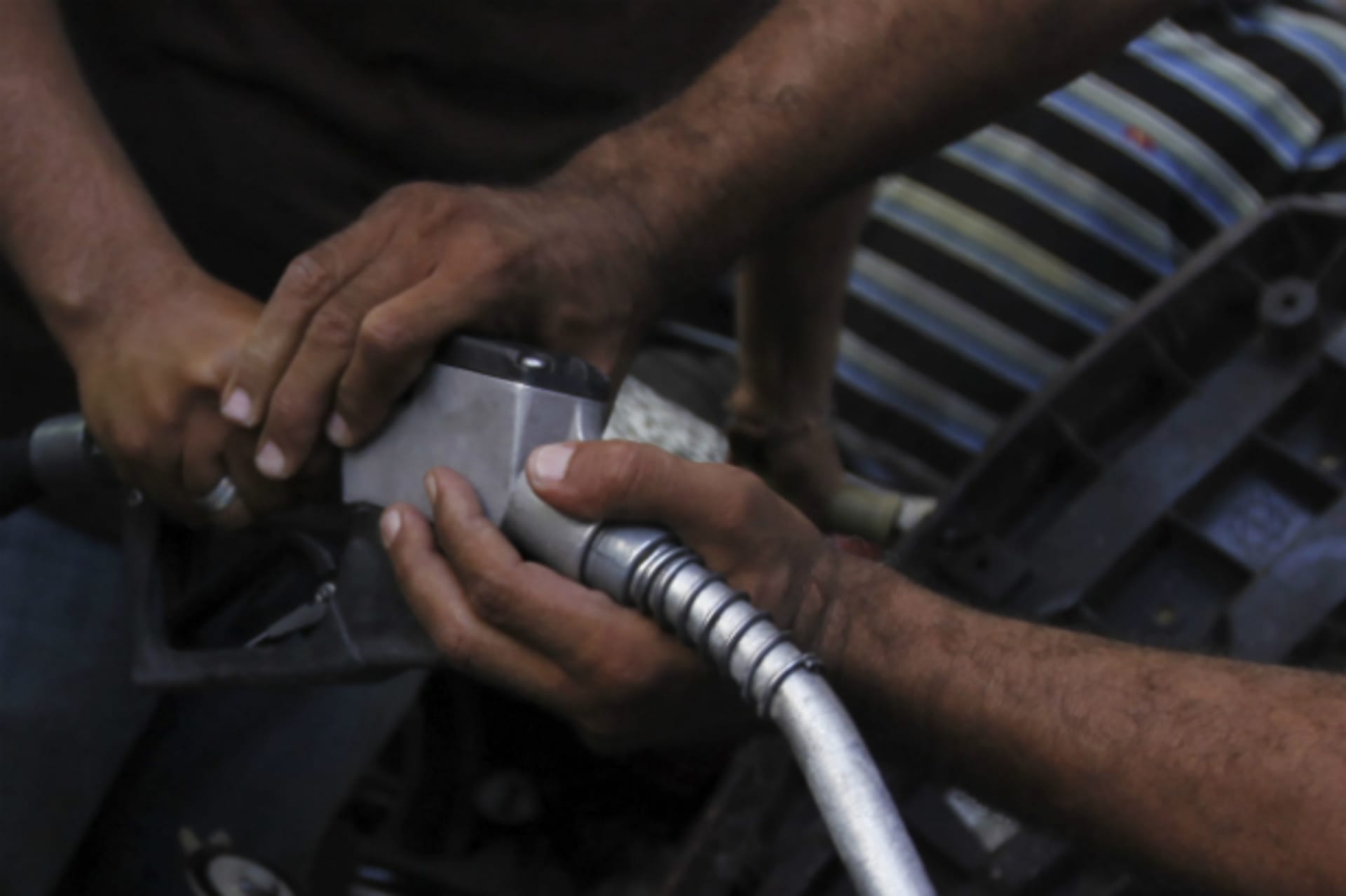 <p>People jostle for a pump nozzle at a petrol station during a fuel shortage in Cairo (Reuters/Abd El Ghany)</p>
