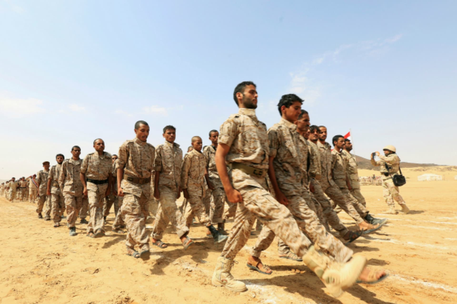 <p>Pro-government soldiers march during a military parade celebrating the 54th anniversary of North Yemen’s revolution in the central province of Marib (Ali Owidha/Reuters).</p>
