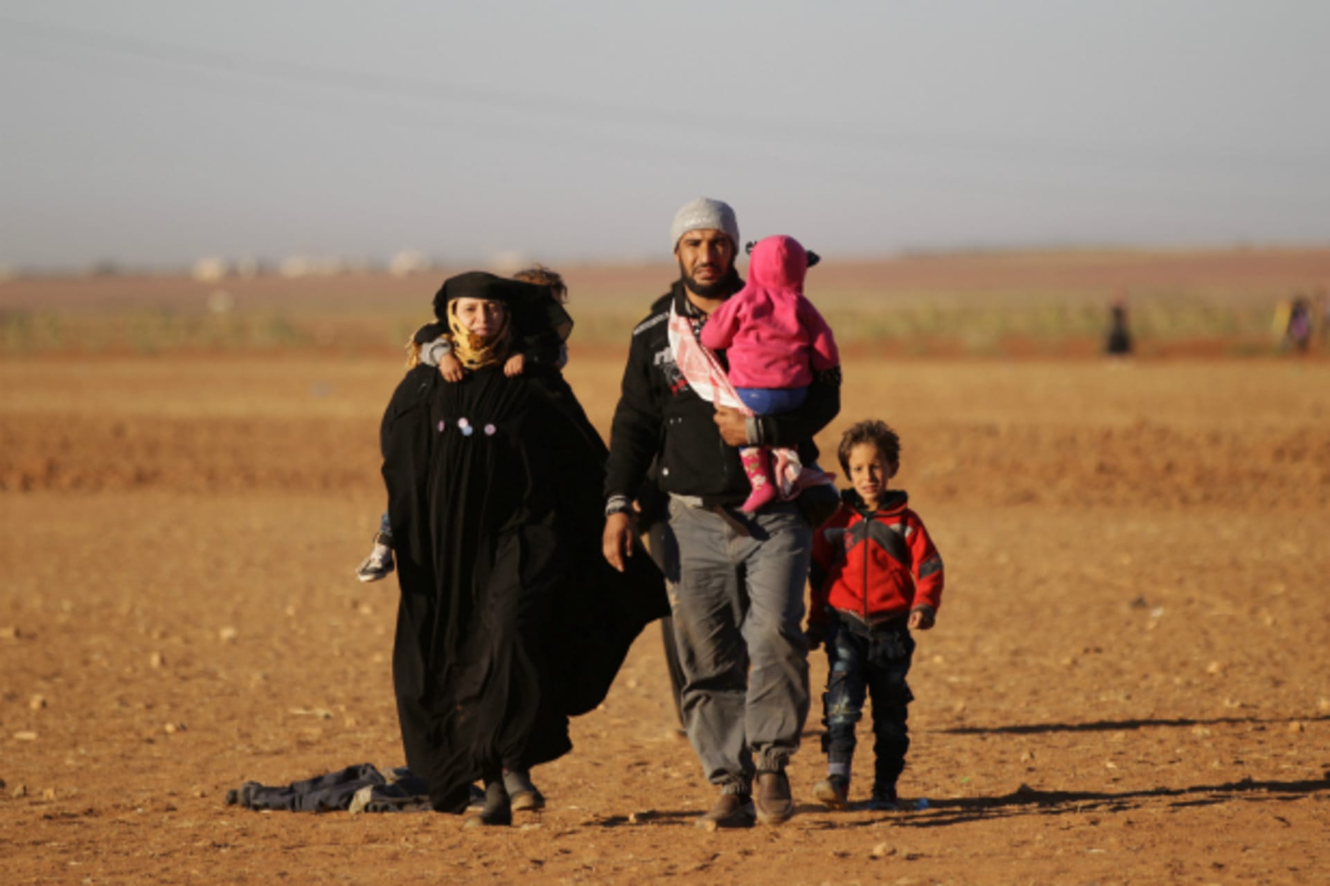 <p>People who fled from Islamic State-controlled areas arrive in the northern Syrian rebel-held town of Waqf, near al-Rai town, in Aleppo Governorate, Syria (Khalil Ashawi/Reuters).</p>
