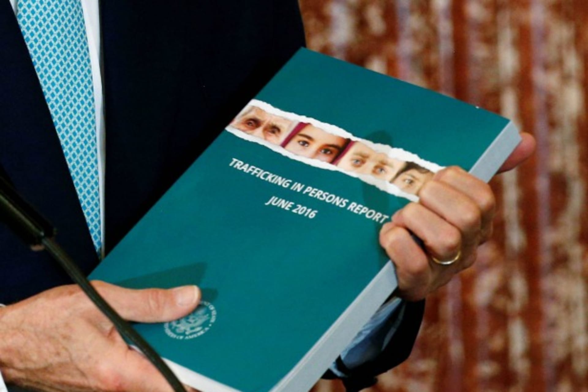 <p>U.S. Secretary of State John Kerry holds a copy of the 2016 Trafficking in Persons (TIP) report during the TIP Heroes Ceremony at the State Department in Washington, June 30, 2016 (Reuters/Kevin Lamarque).</p>
